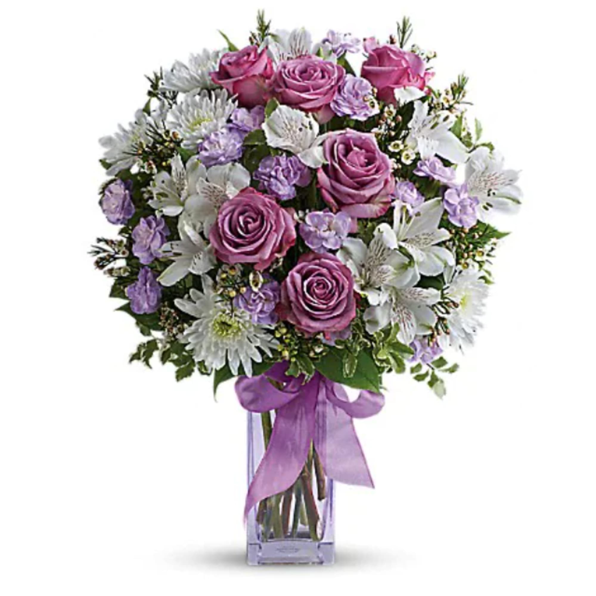 Pink roses and white lilies in a clear glass vase with a purple ribbon