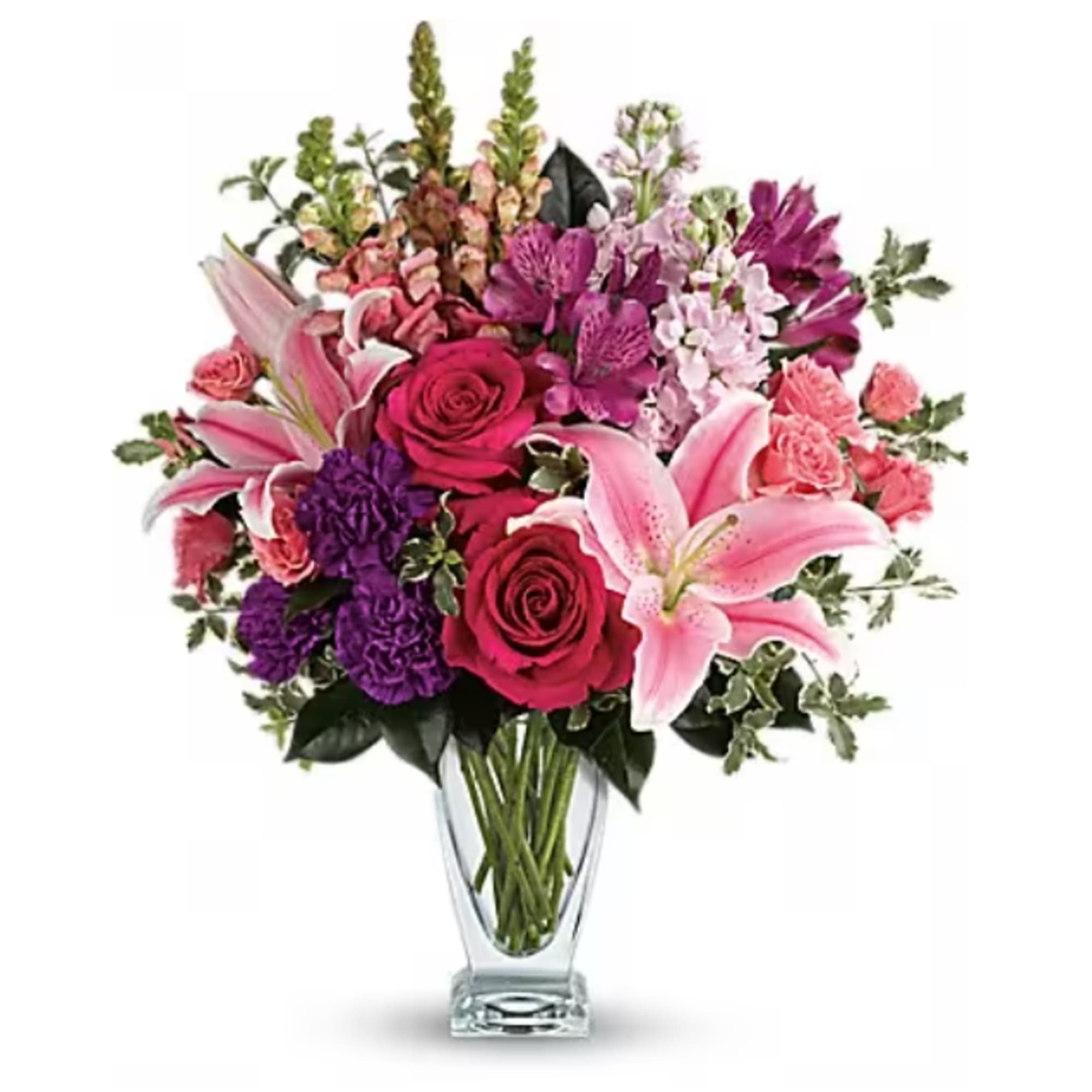 Bouquet of pink and purple flowers in a clear glass vase