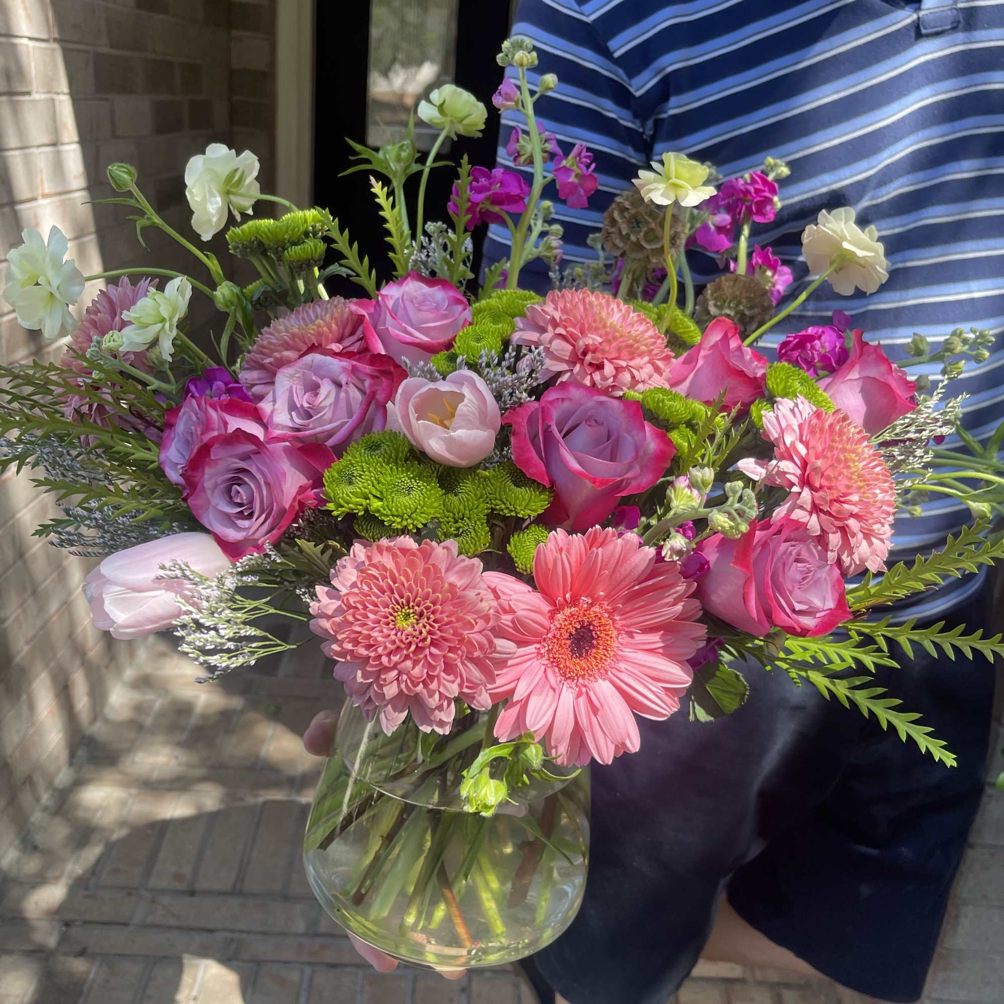 Pink and lavender mixed bouquet in a clear glass vase