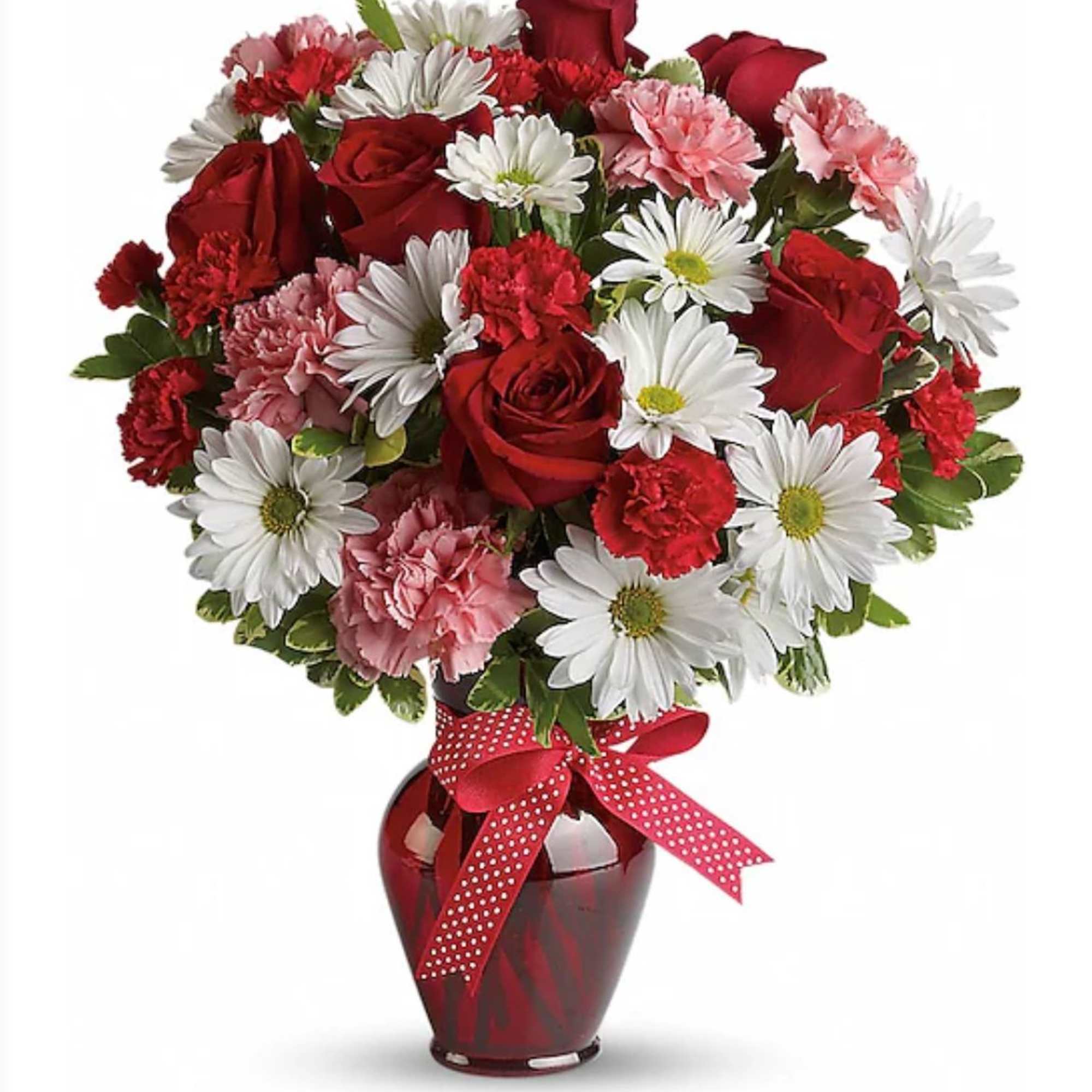 Bouquet of red roses, white daisies, and pink carnations in a red vase