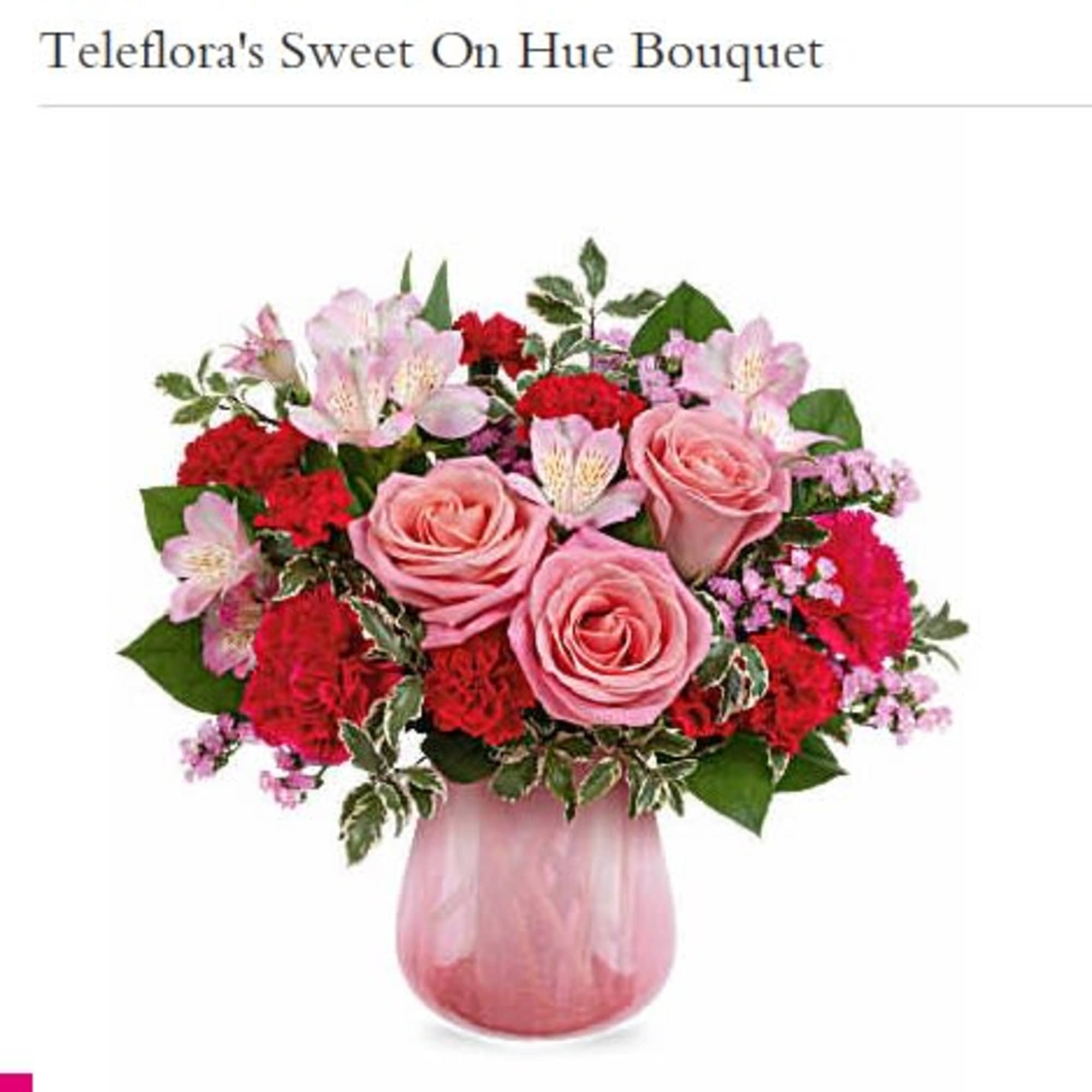 Pink roses and red carnations in a pink glass vase