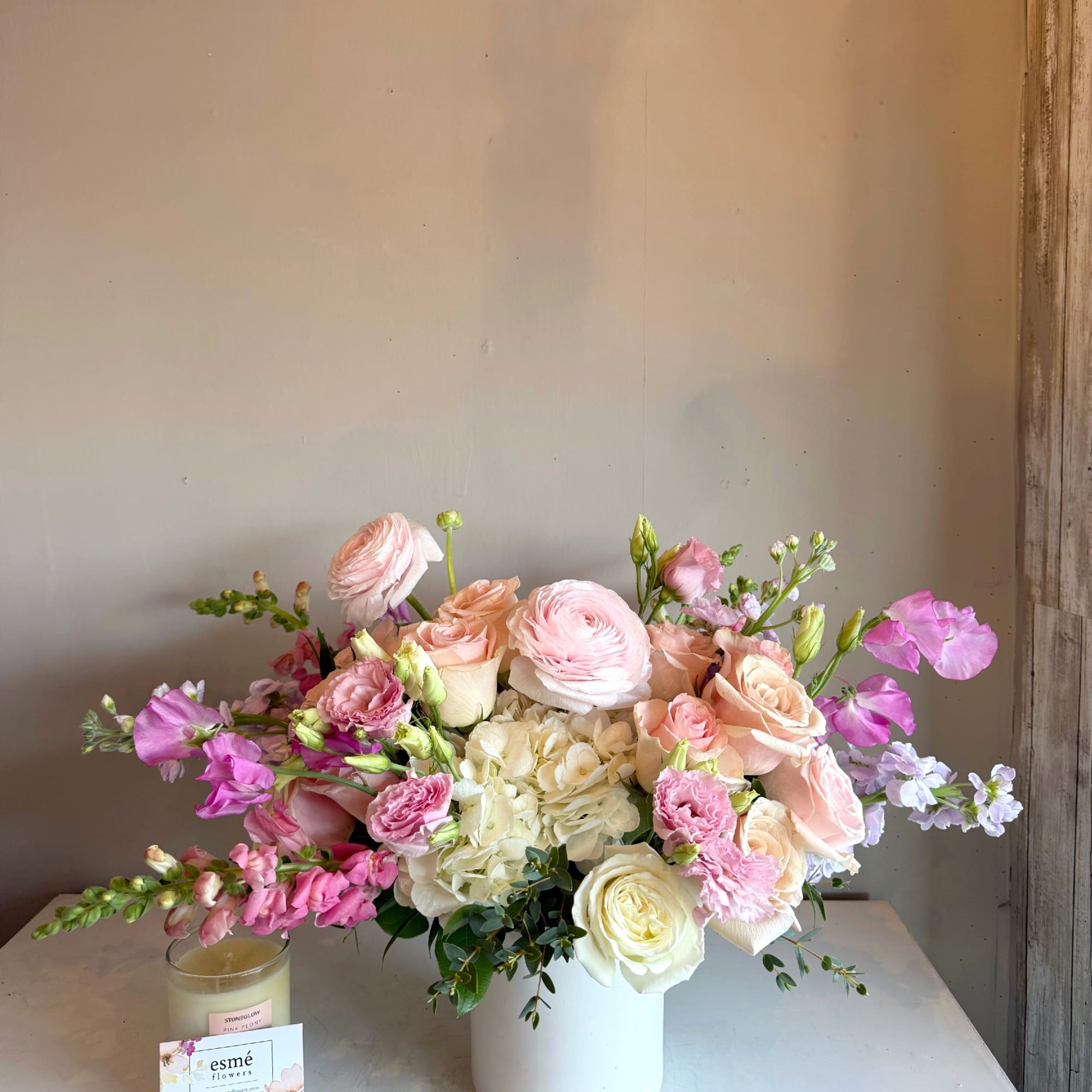 Soft, romantic, and timeless. This arrangement blends blush pink and creamy white