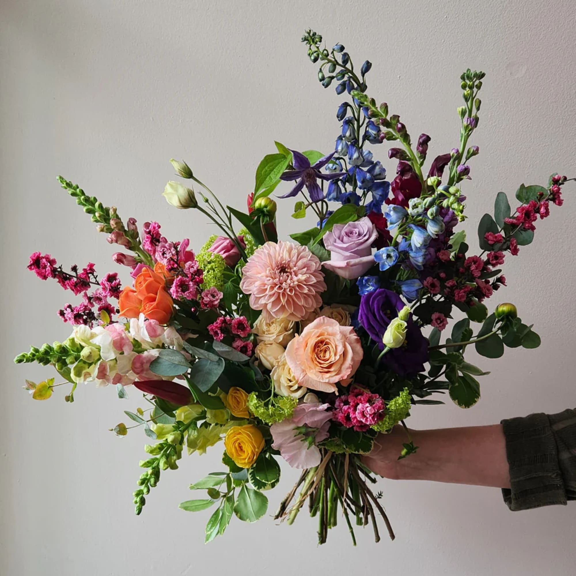 Colorful mixed bouquet with roses, dahlias, and snapdragons