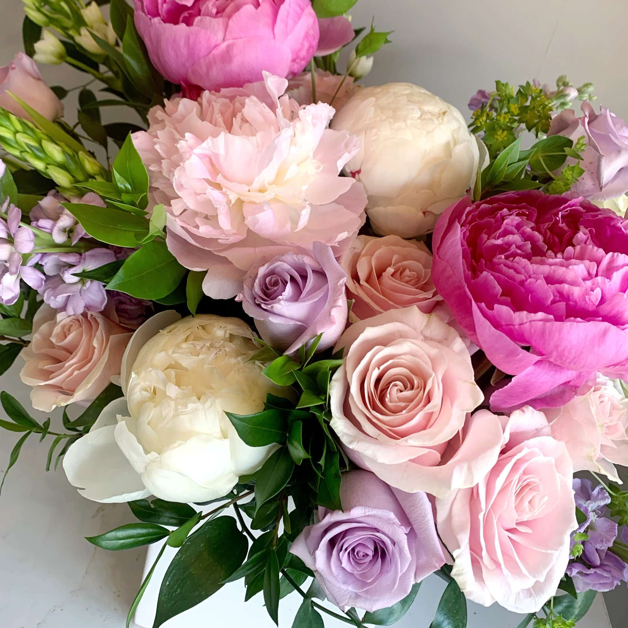 An assortment of Dutch peonies with ocean song and pink mondial roses