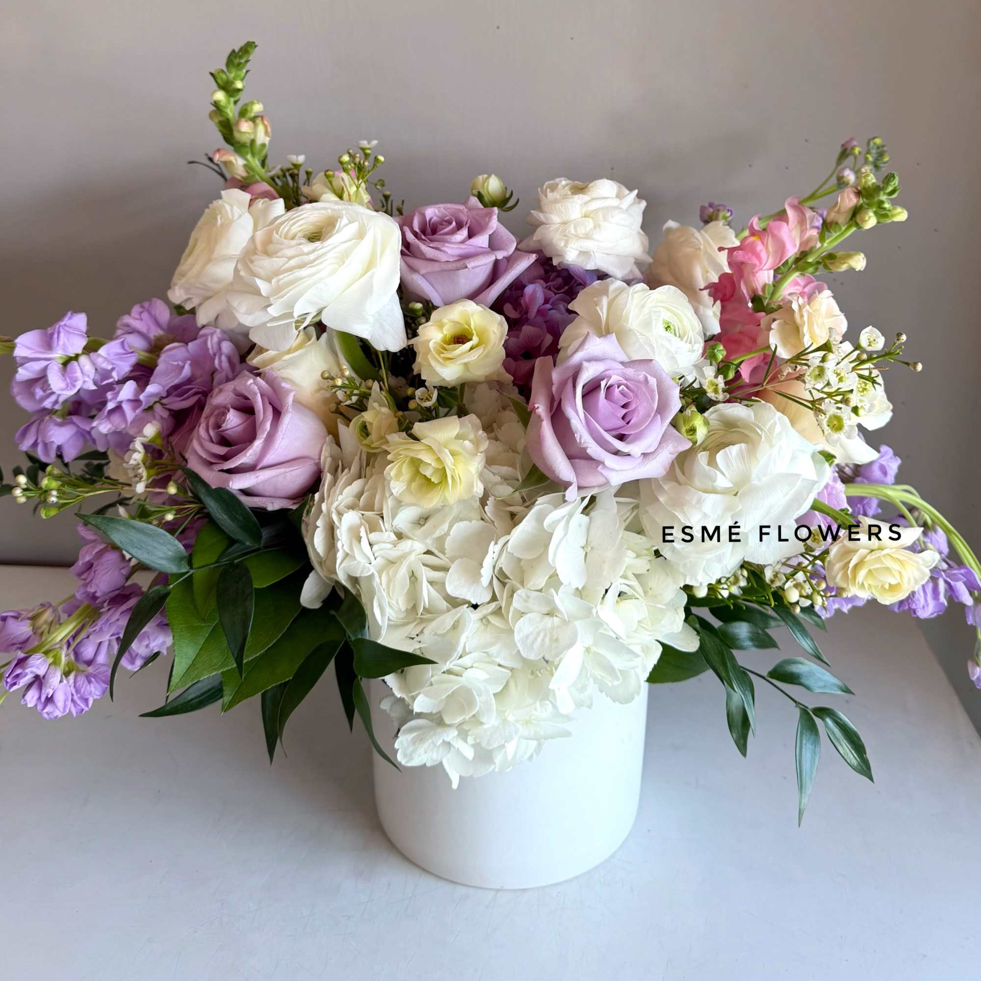 A serene blend of soft lavender and creamy white blooms in a