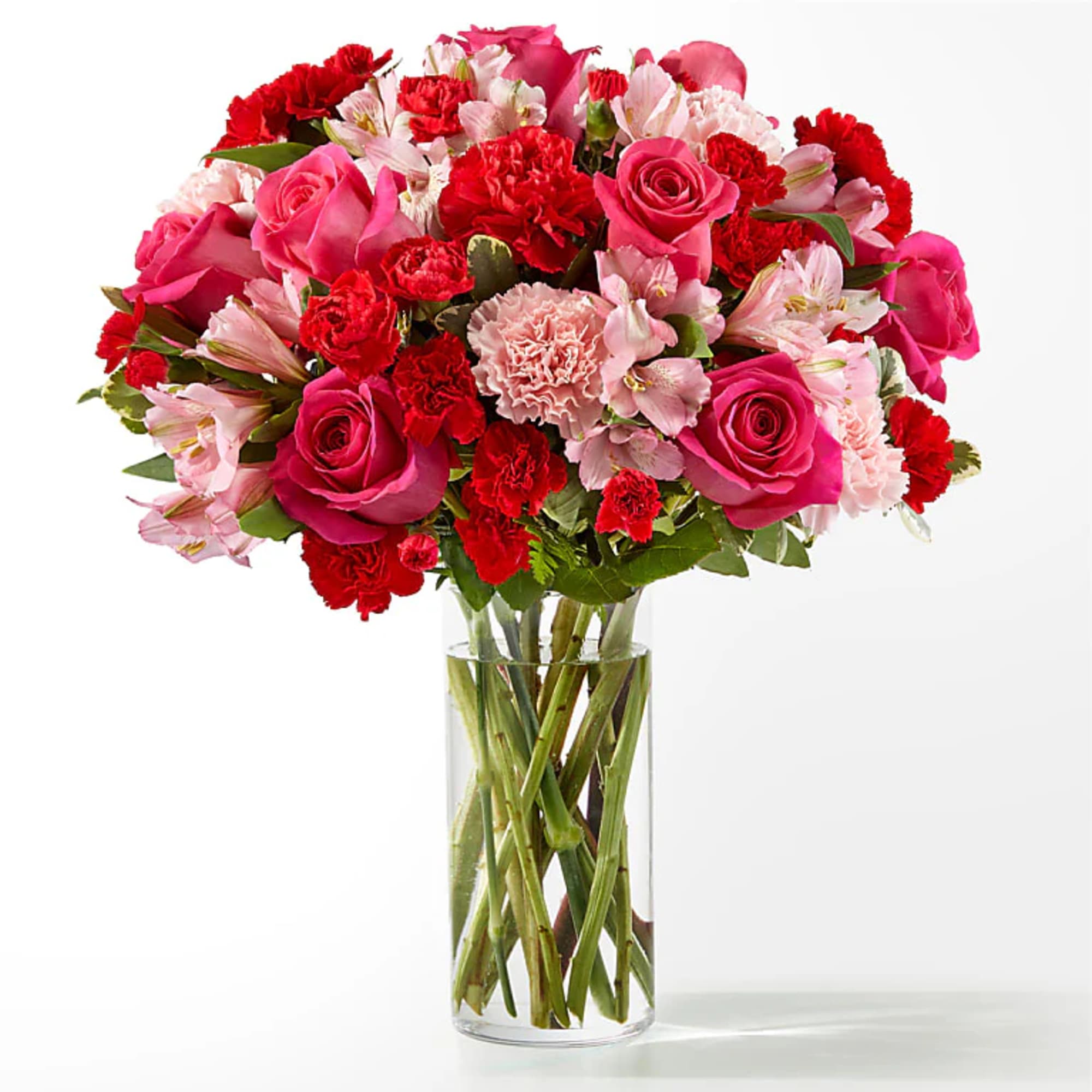 Pink and red mixed bouquet in a clear glass vase