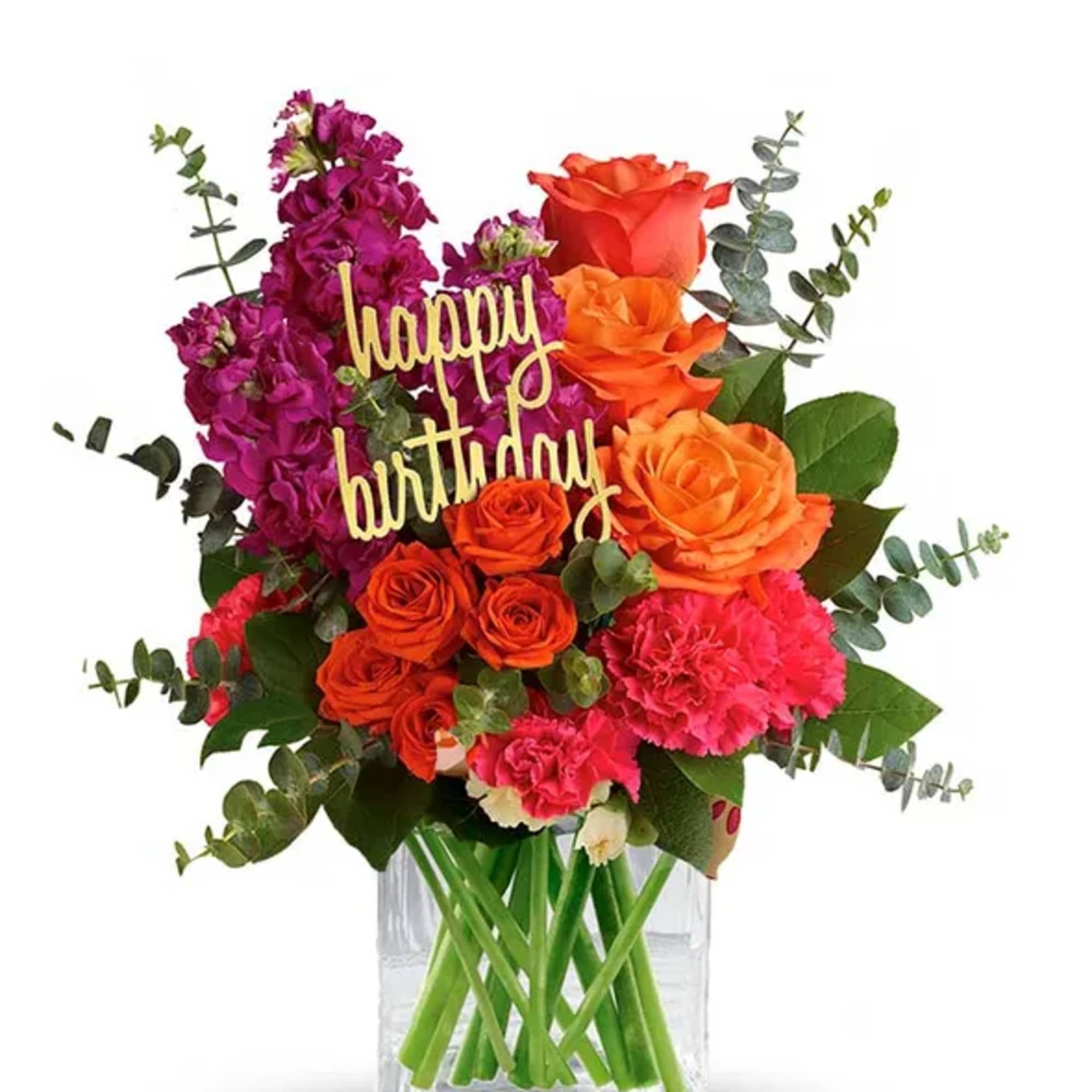 Birthday bouquet of orange and pink flowers in a glass vase