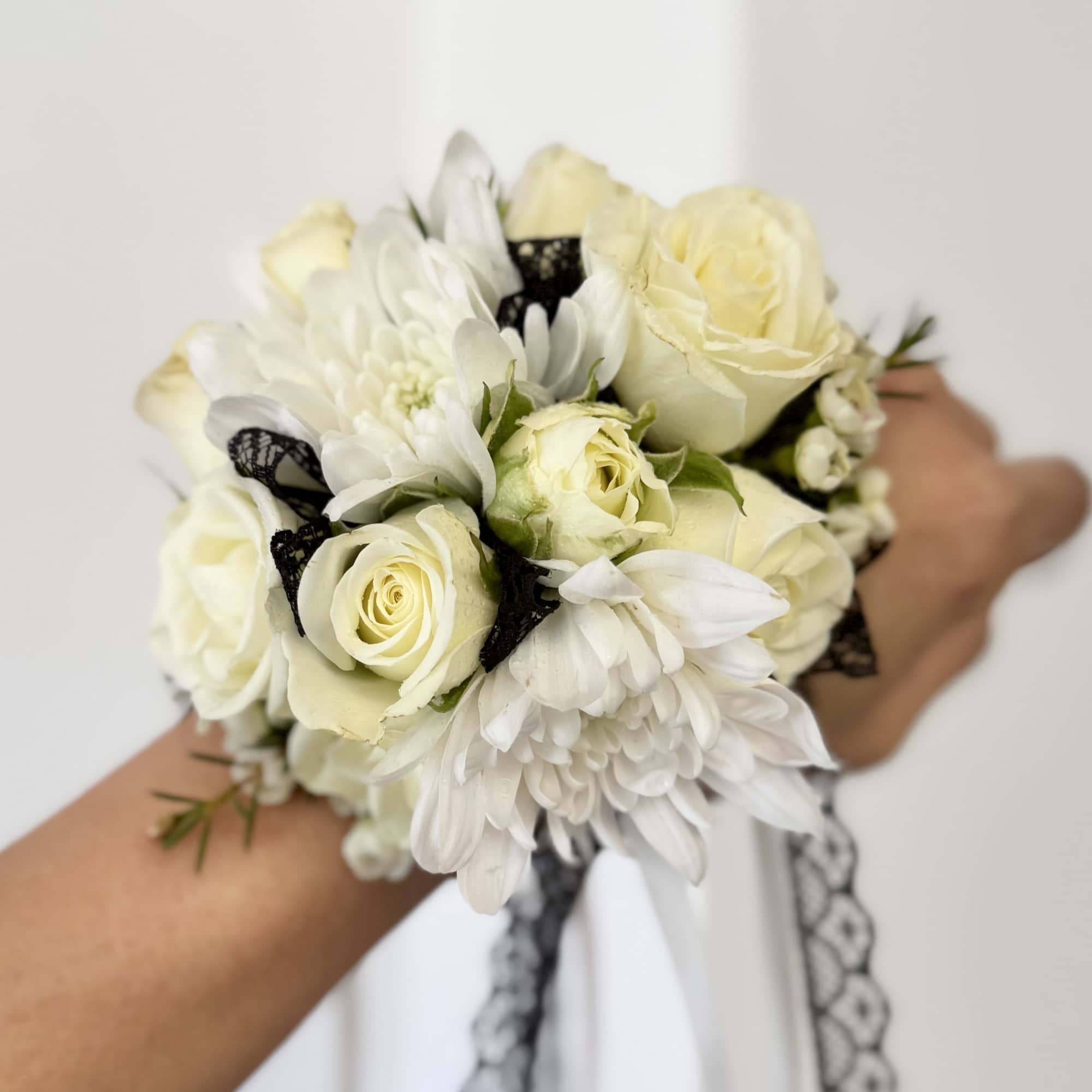 White rose and chrysanthemum bouquet with black lace ribbon