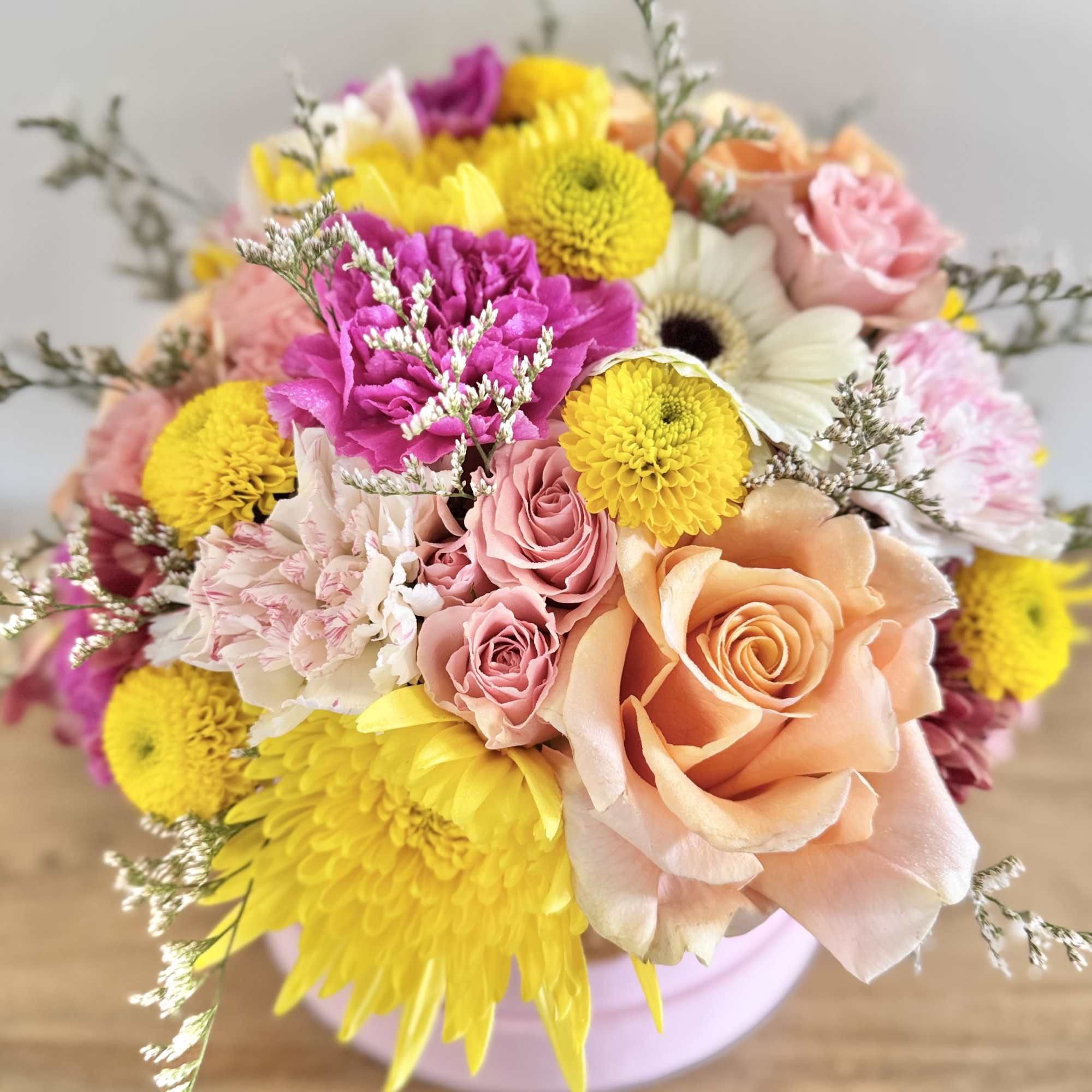 A beautiful mix of colors and flowers specially selected by the Florist.