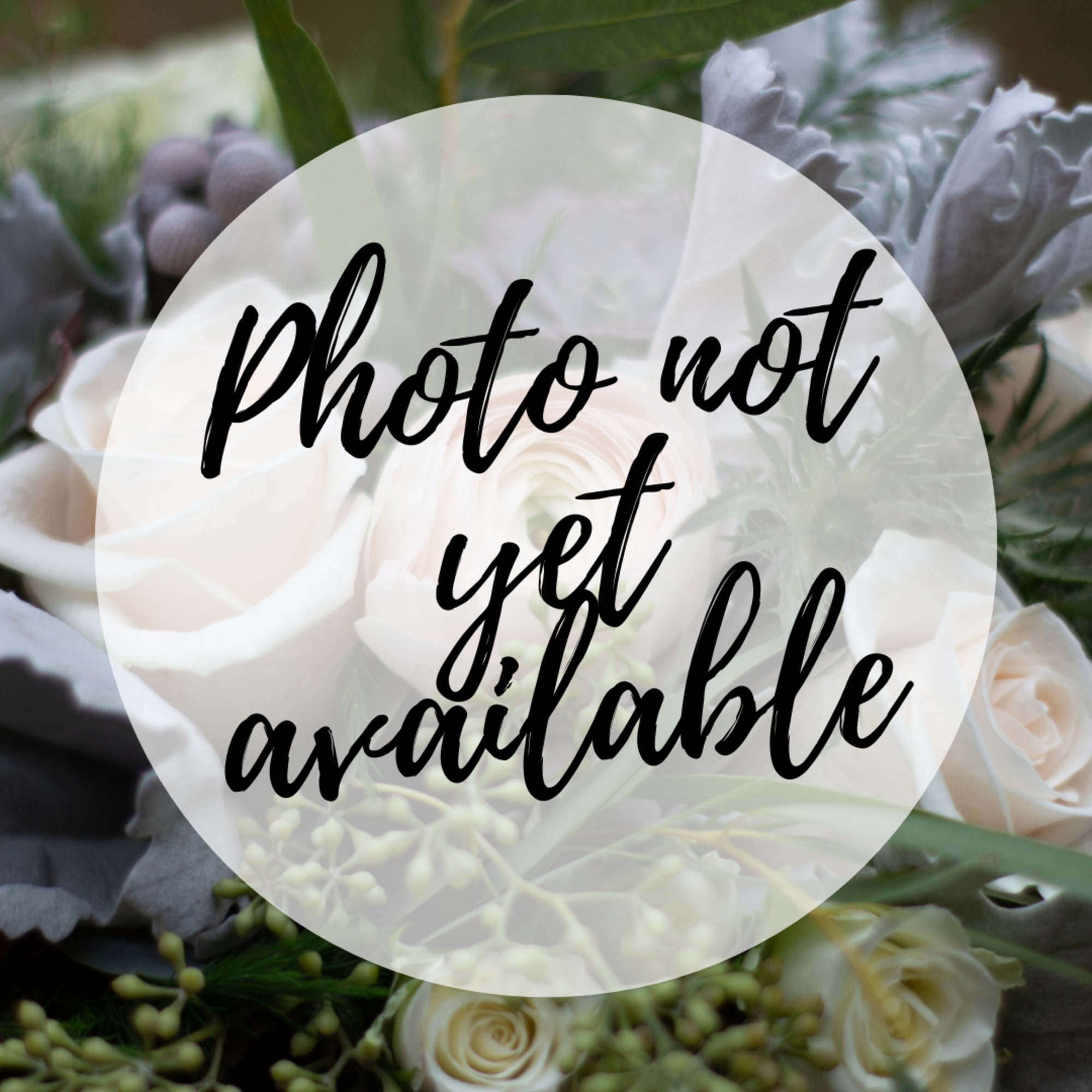 Blurred bouquet of white and pale peach roses with a text overlay