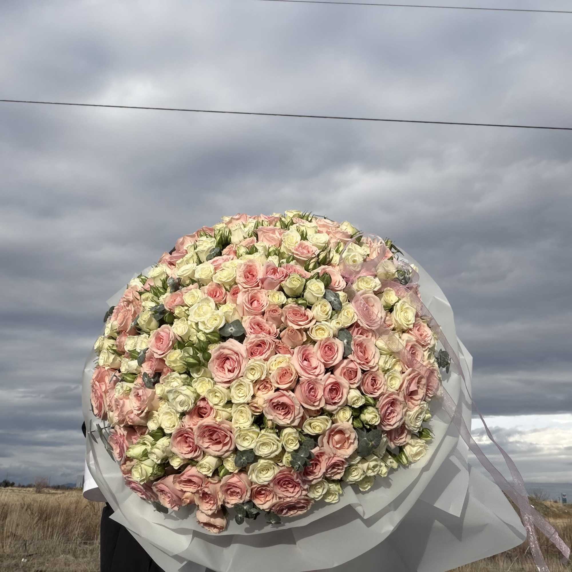 An exquisite expression of elegance, this grand arrangement features a lavish composition