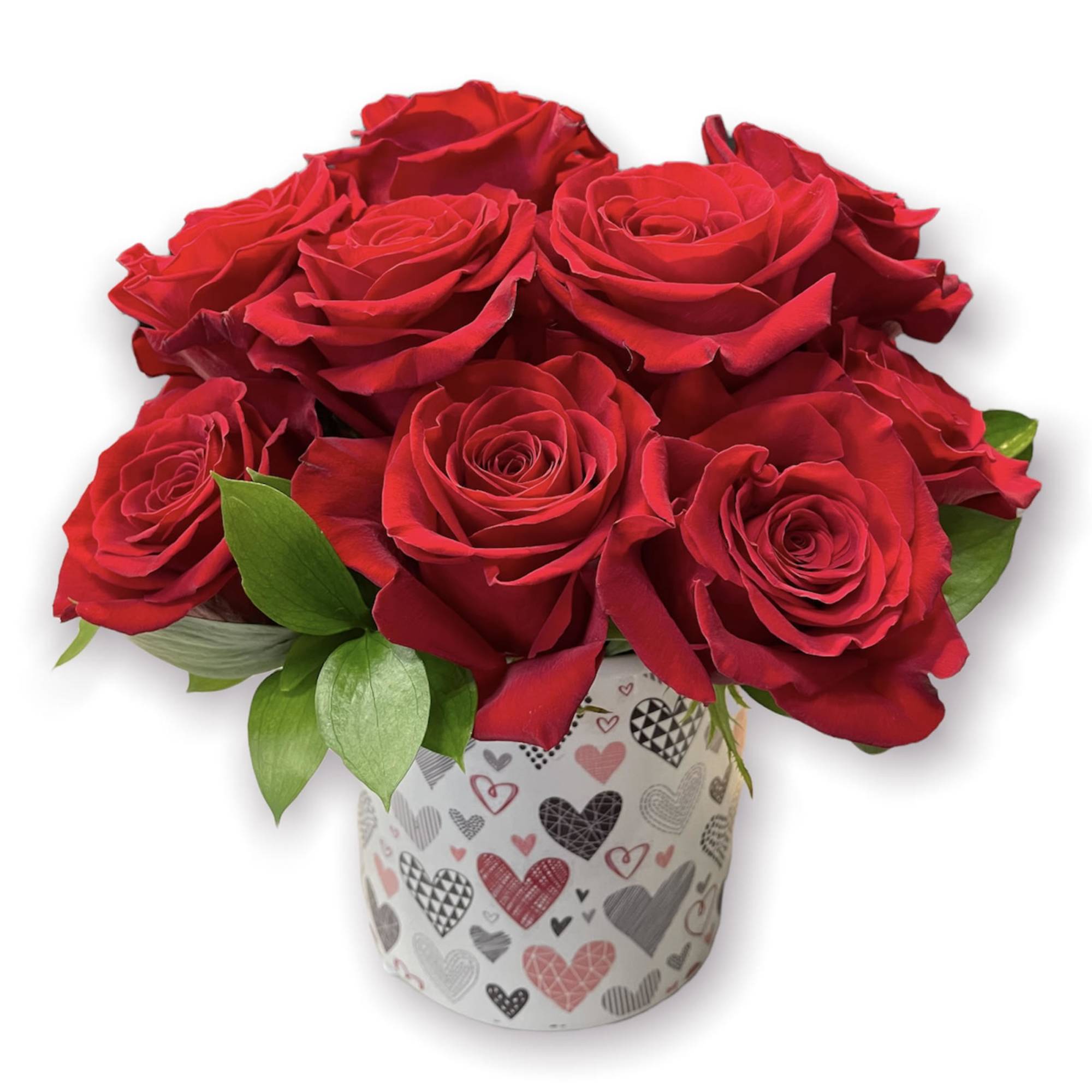Red roses arranged in a heart-patterned gift box