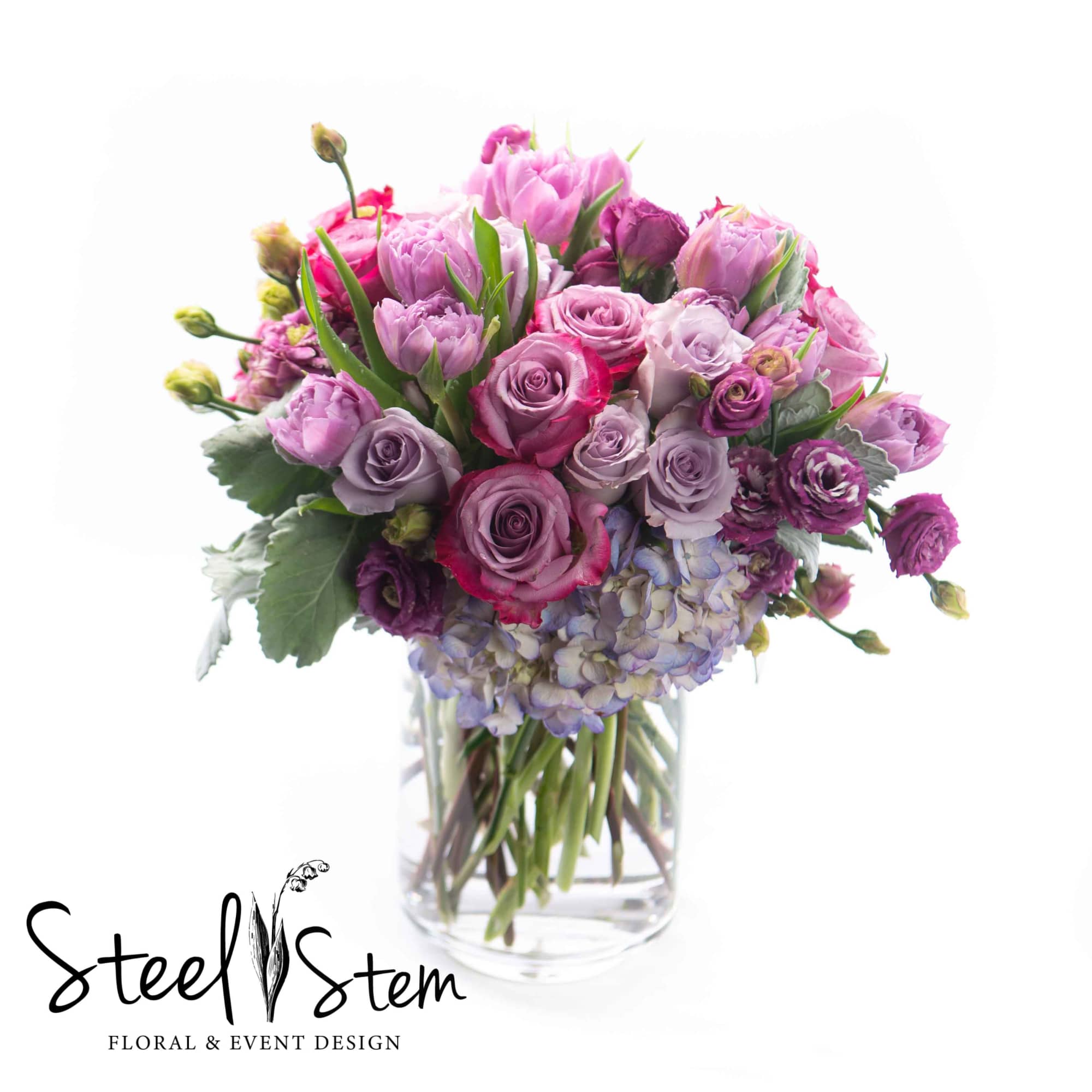 Pink and lavender bouquet in a clear glass vase