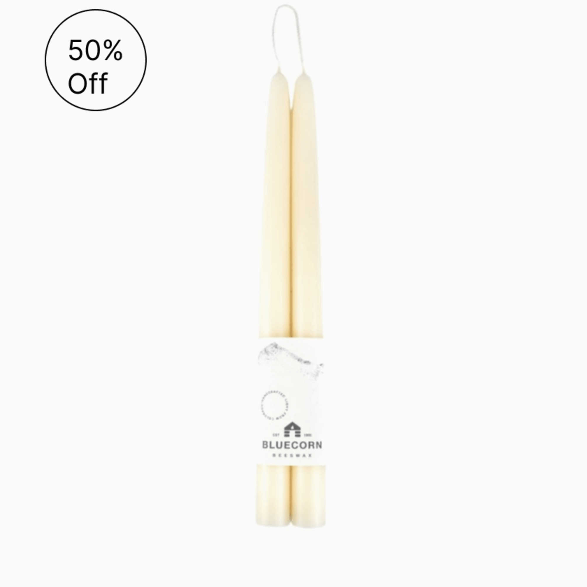 Pair of cream taper candles wrapped together with a Bluecorn Beeswax label