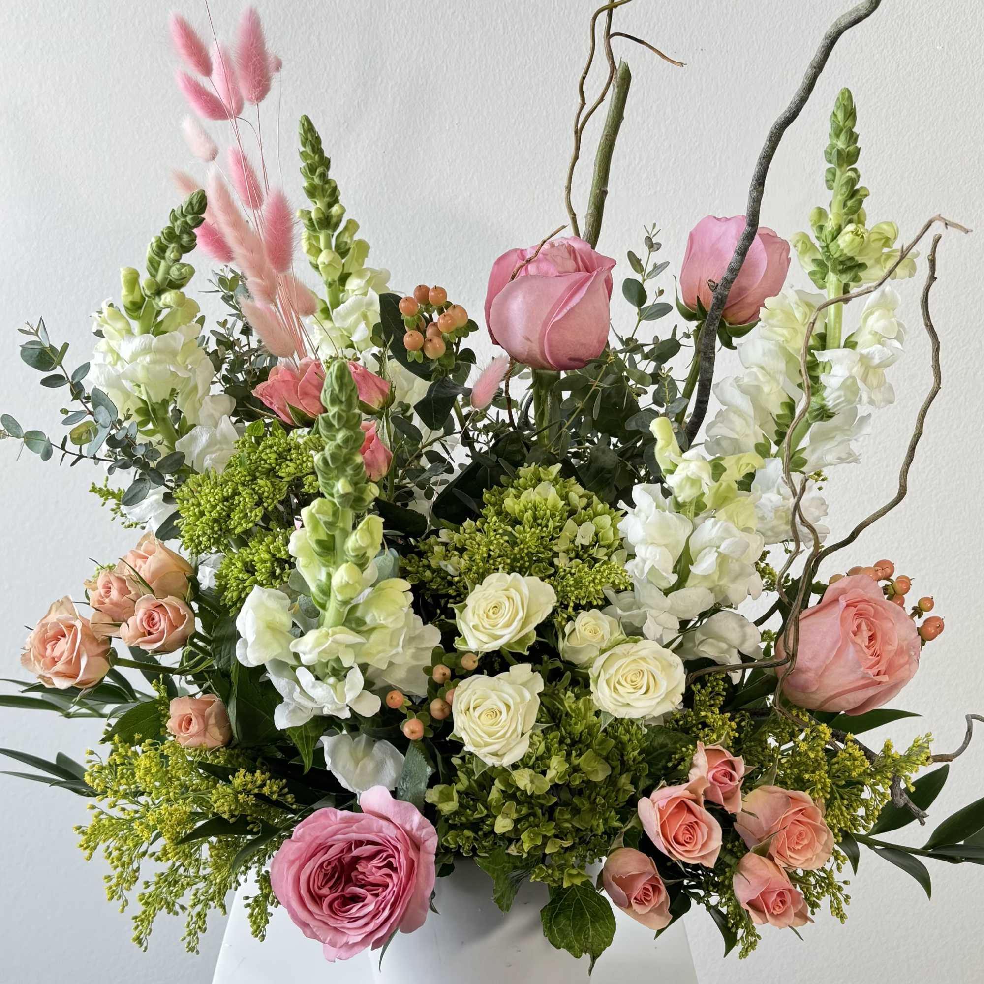 Discover the free-spirited charm of Boho Peach, a whimsical bohemian flower arrangement