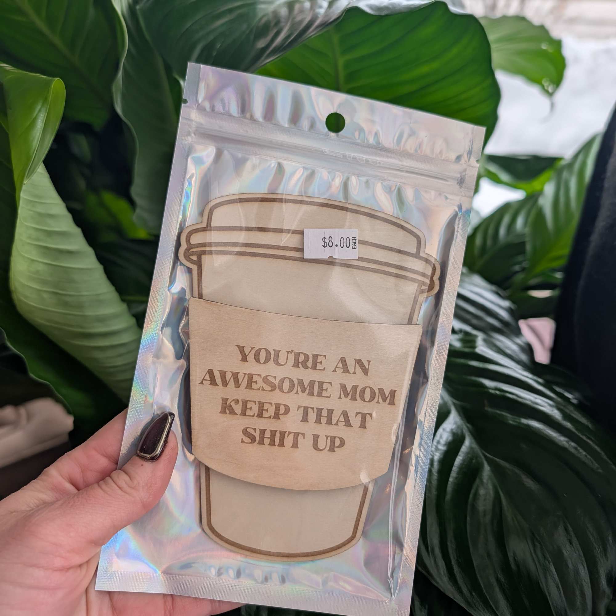 Packaged greeting card with a coffee cup design and bold text