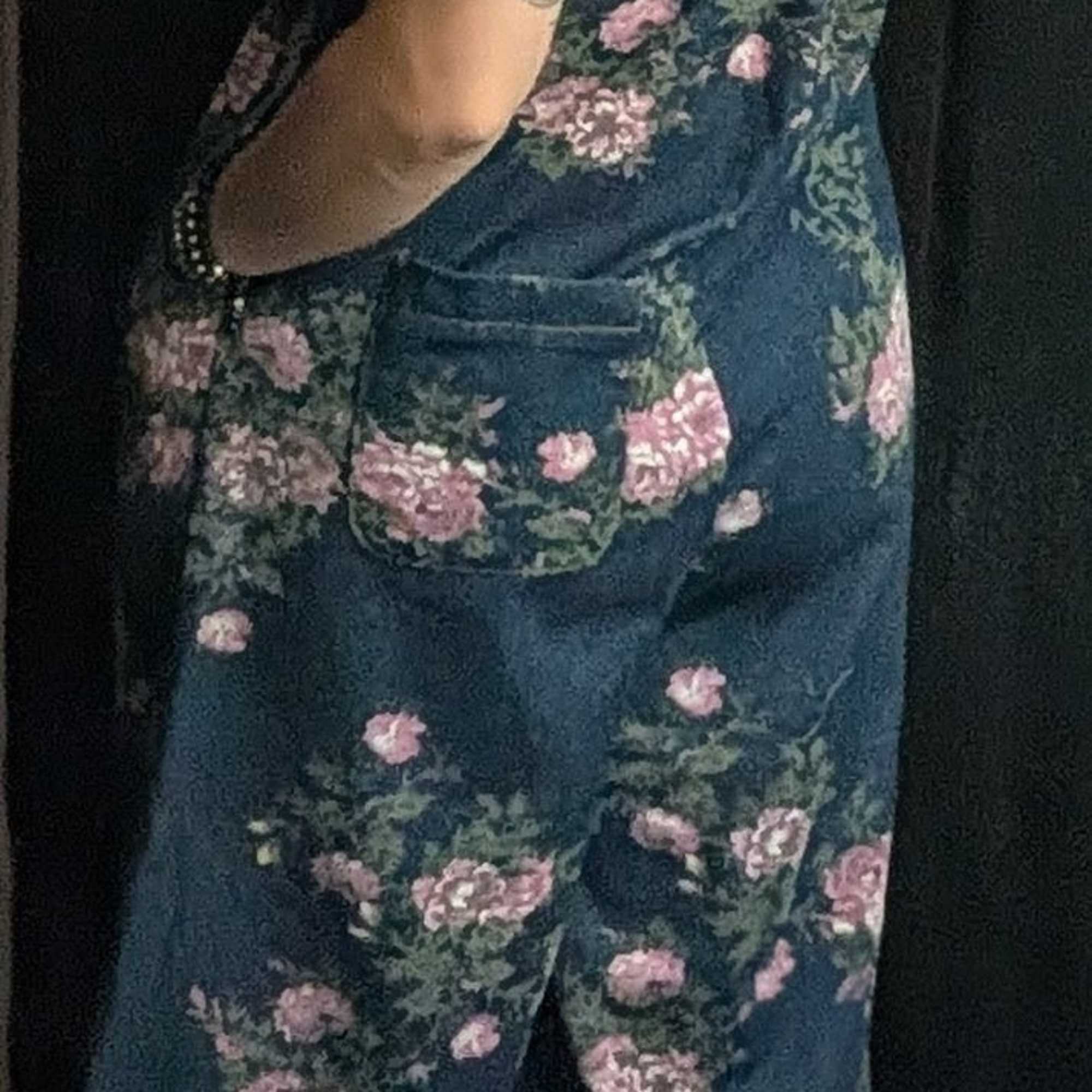 Oversized flare leg denim overalls with a front pouch, a back pocket