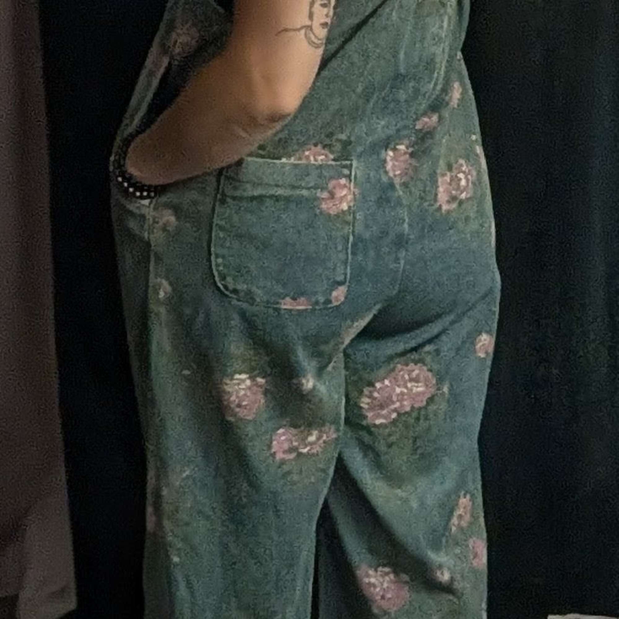 Oversized flare leg denim overalls with a front pouch, a back pocket