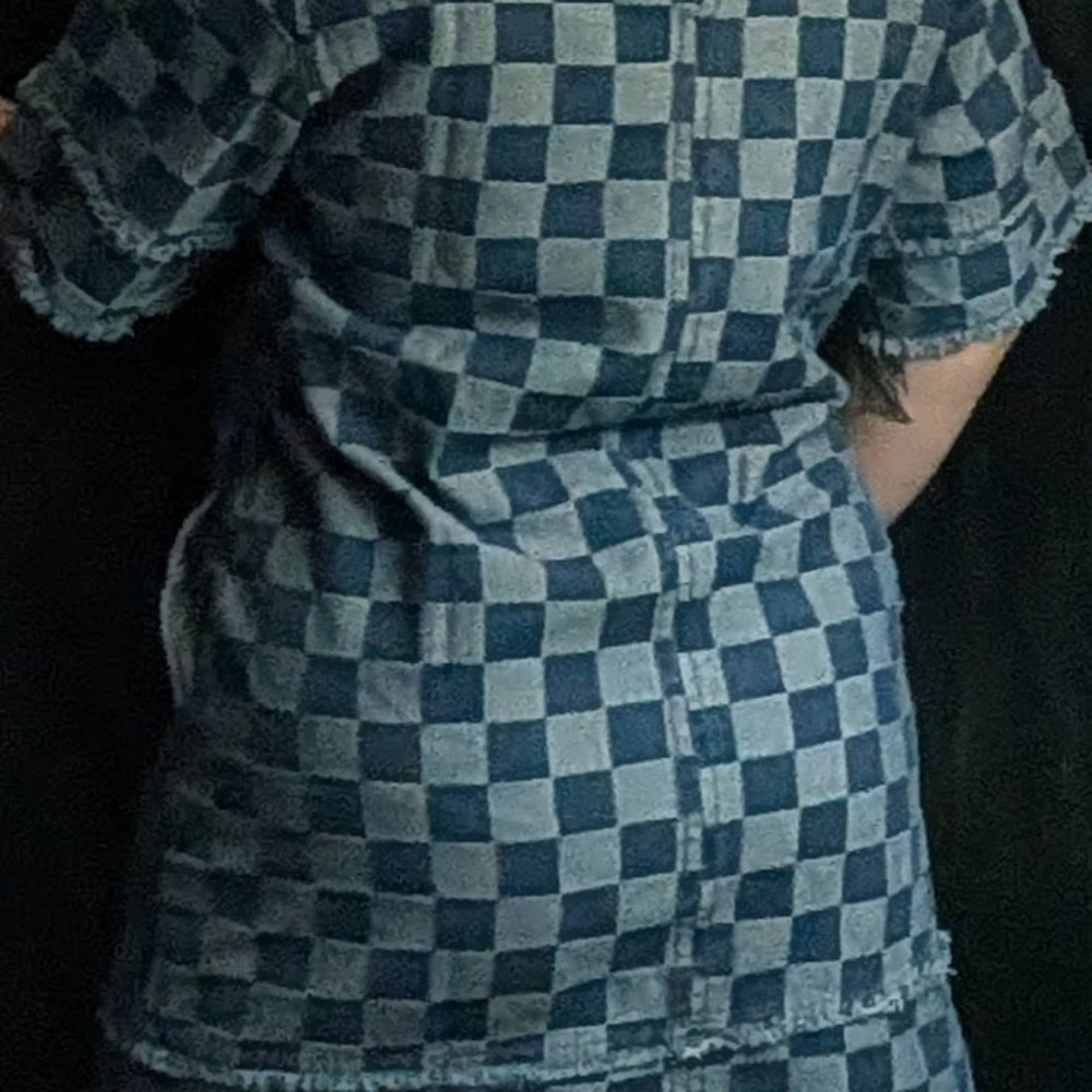 A checkered denim dress with a zipper in the back, and pockets.