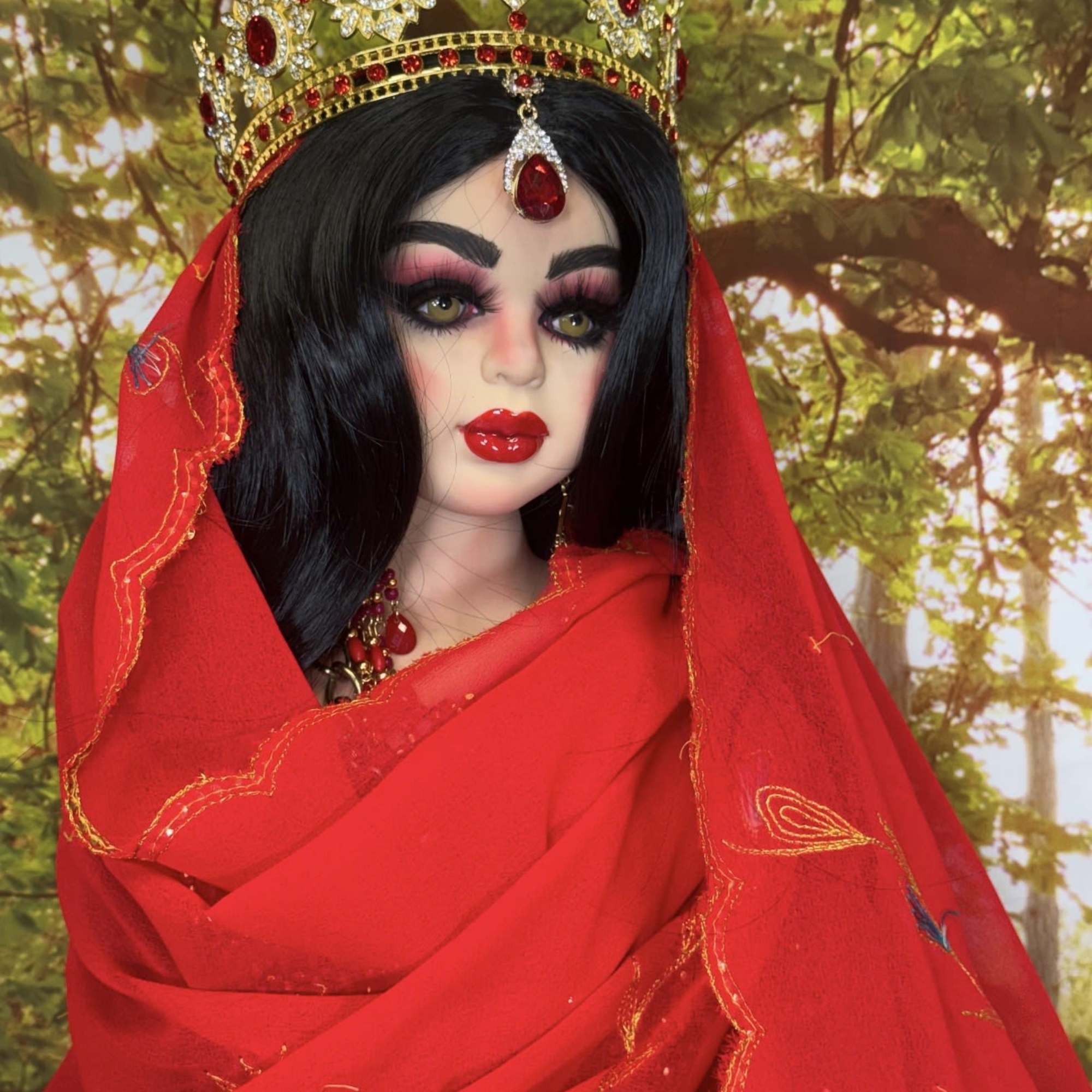 Decorative warrior doll in red-and-gold costume with jeweled crown, veil, and ornate, photo 2 of 3