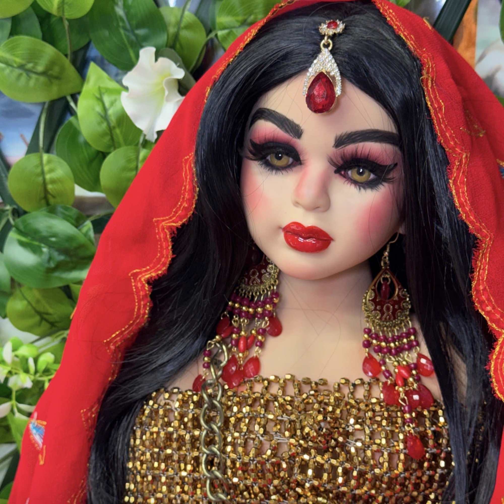 Decorative warrior doll in red-and-gold costume with jeweled crown, veil, and ornate, photo 3 of 3