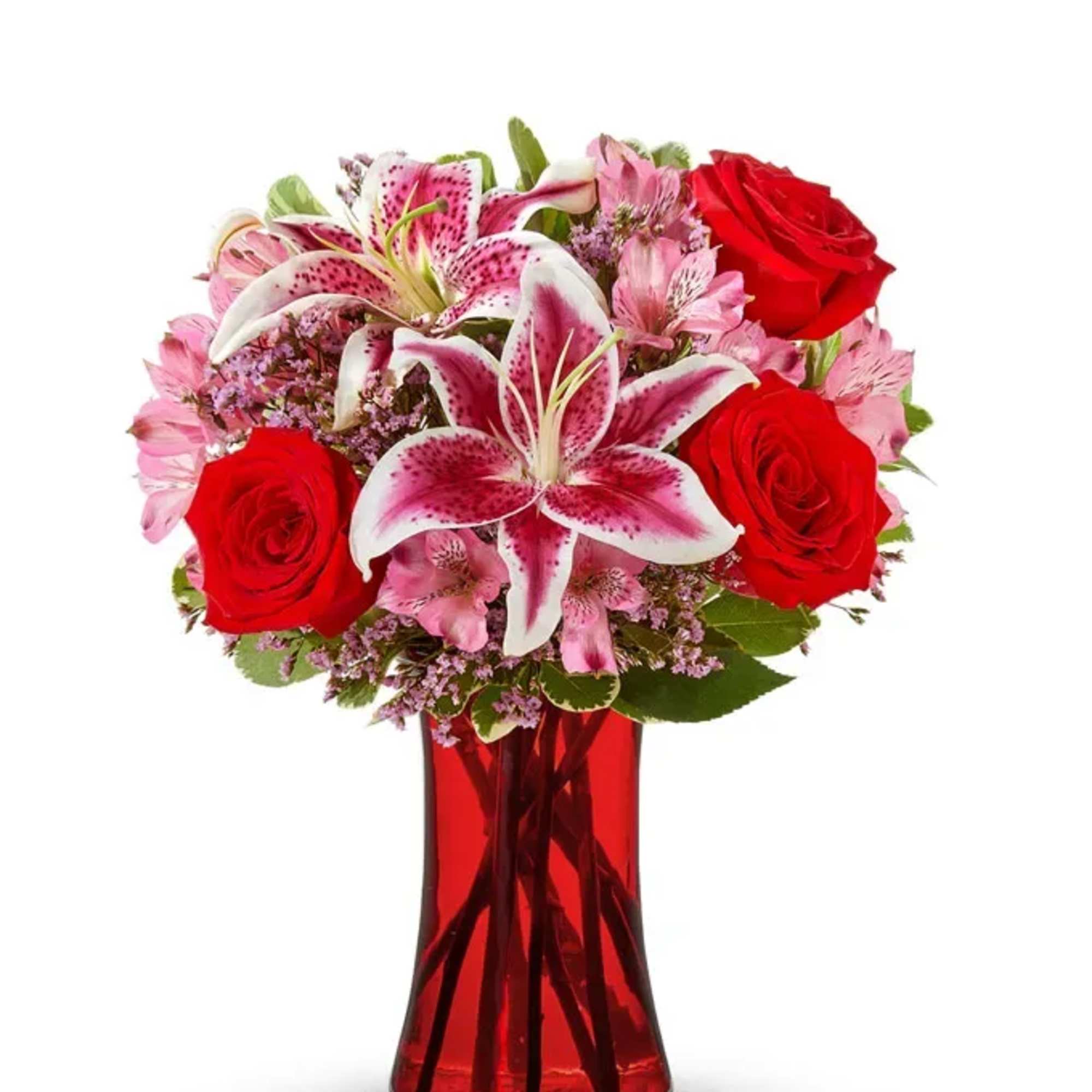 Red roses and pink lilies in a red glass vase