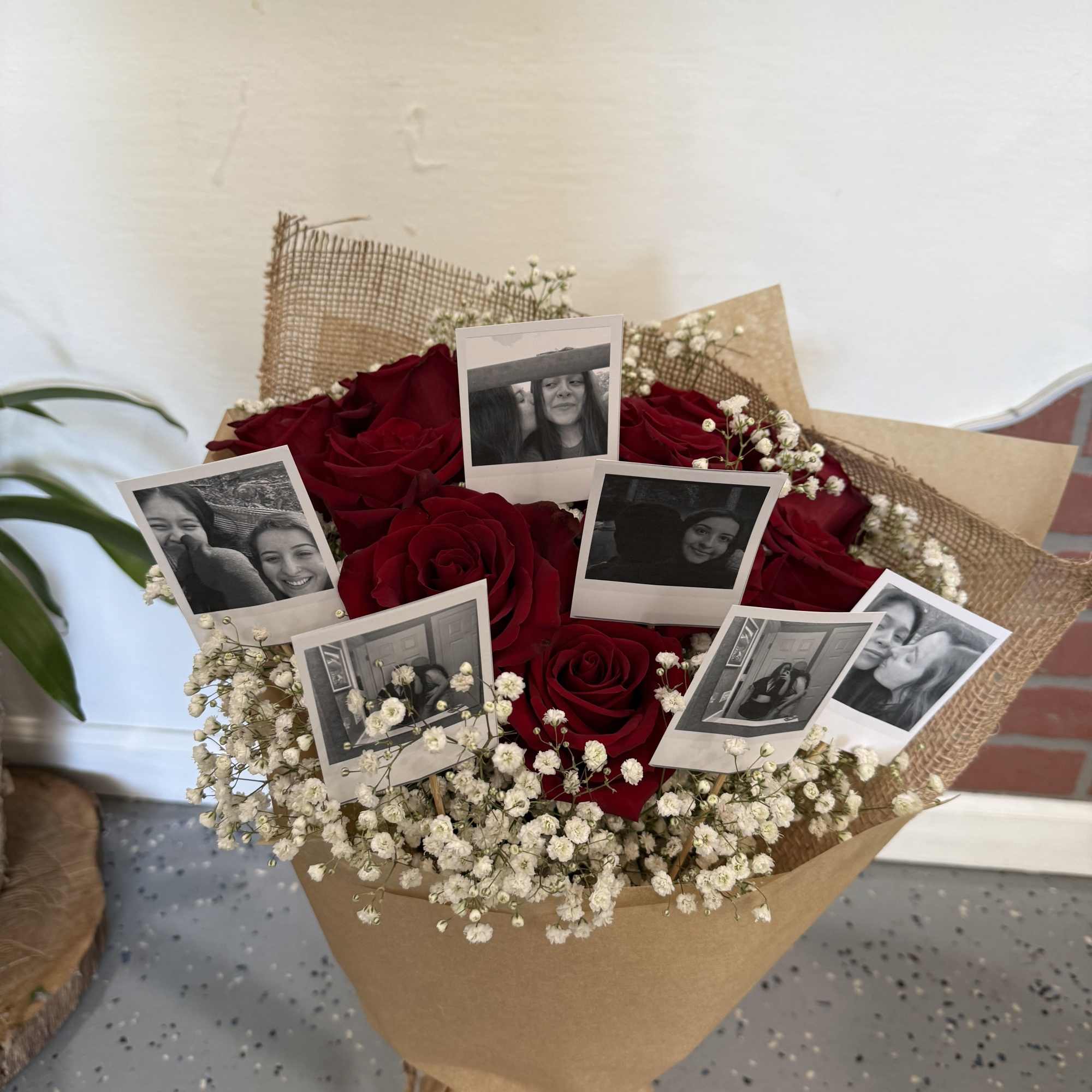 Bouquet of red roses with baby’s breath and photo prints