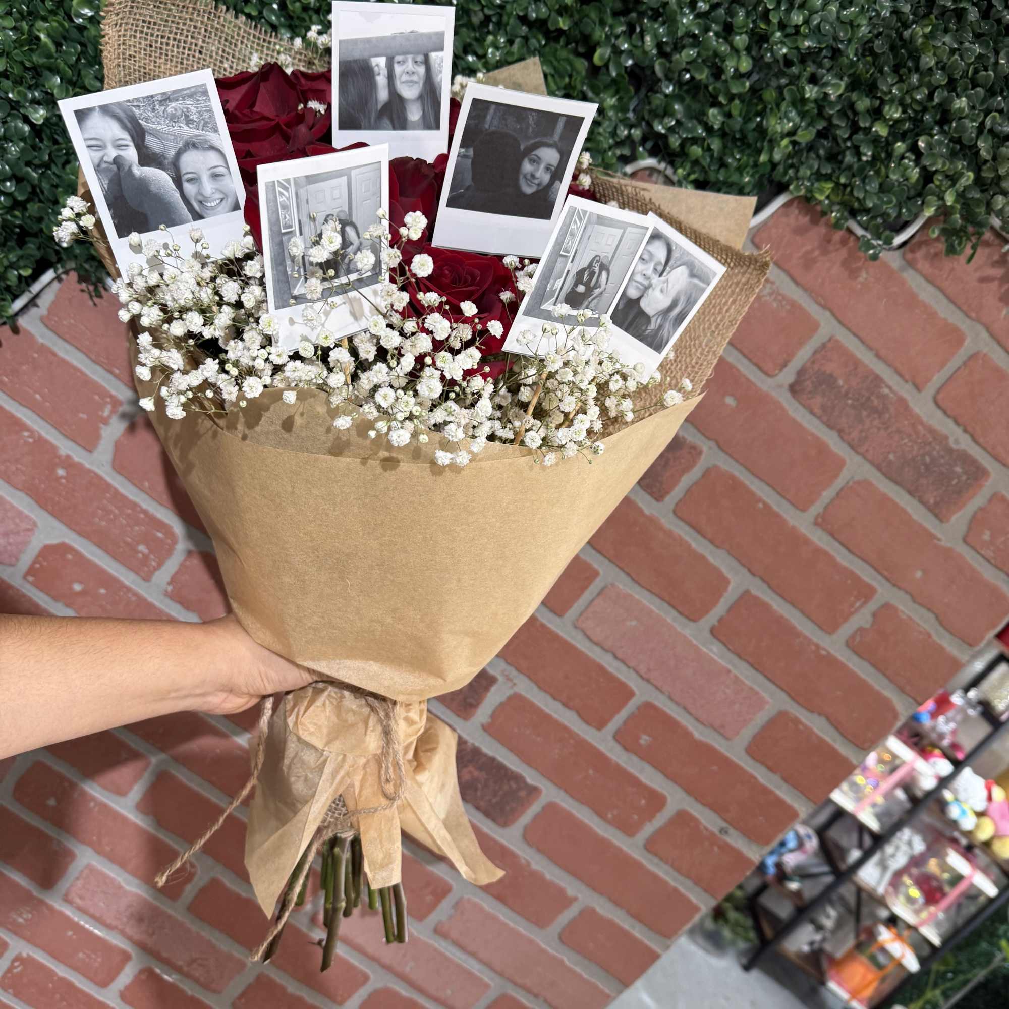 Bouquet of red roses with baby’s breath and photo prints