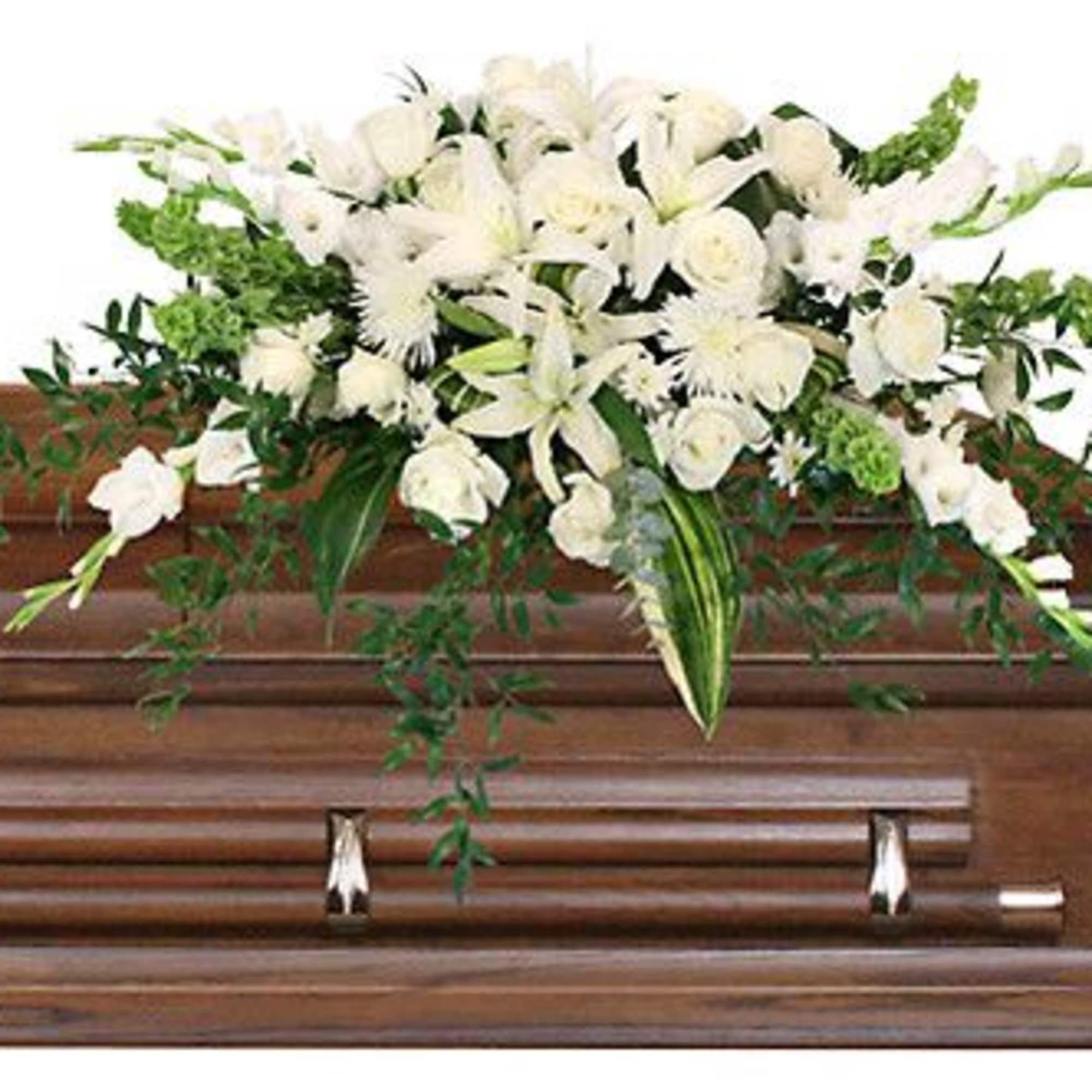 Send your loved one off with an elegant casket spray that truly
