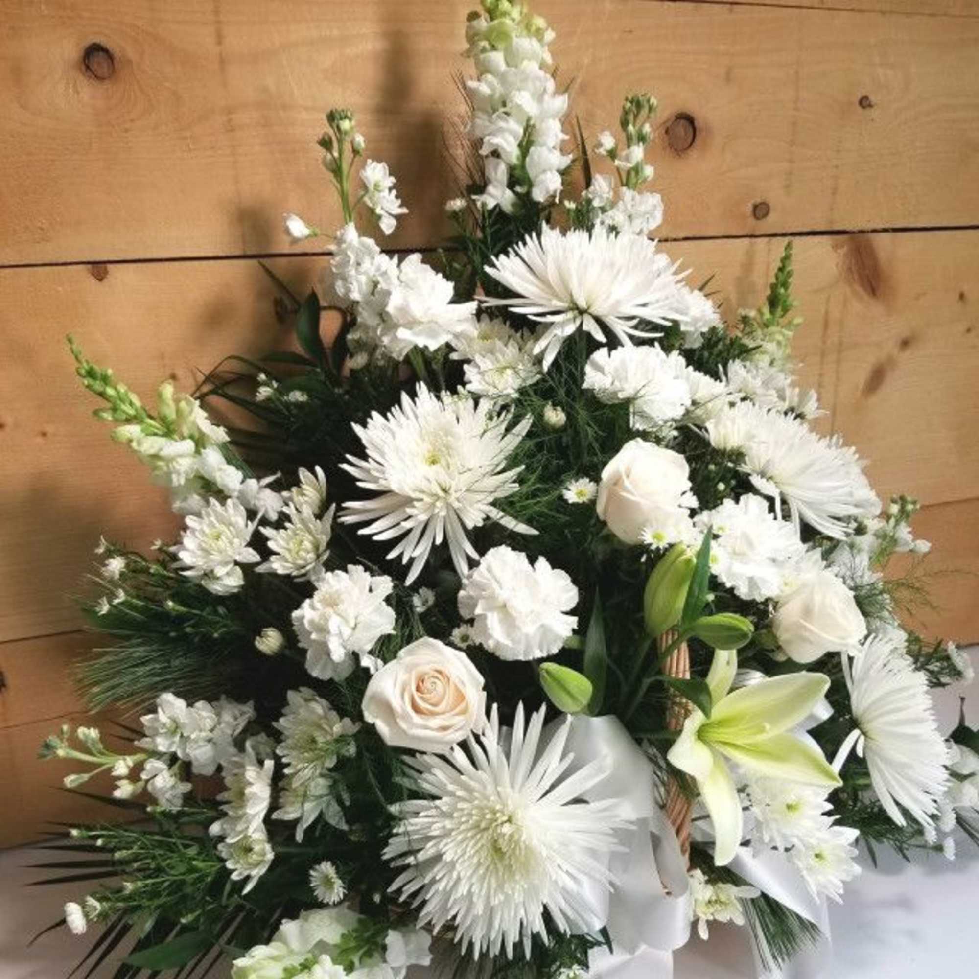 White floral spray with lilies, roses, and daisy-like blooms