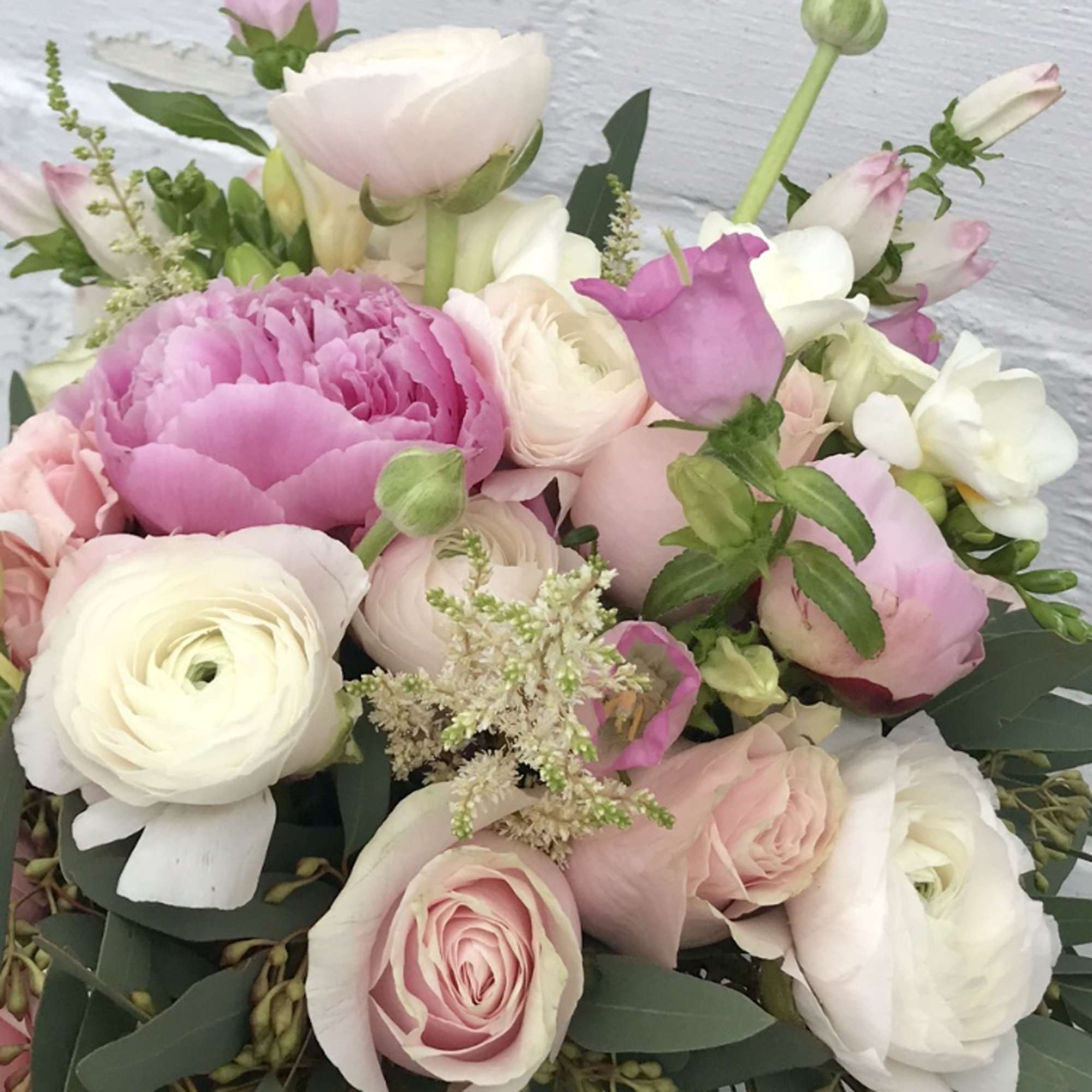 Pink and white mixed bouquet with roses and ranunculus