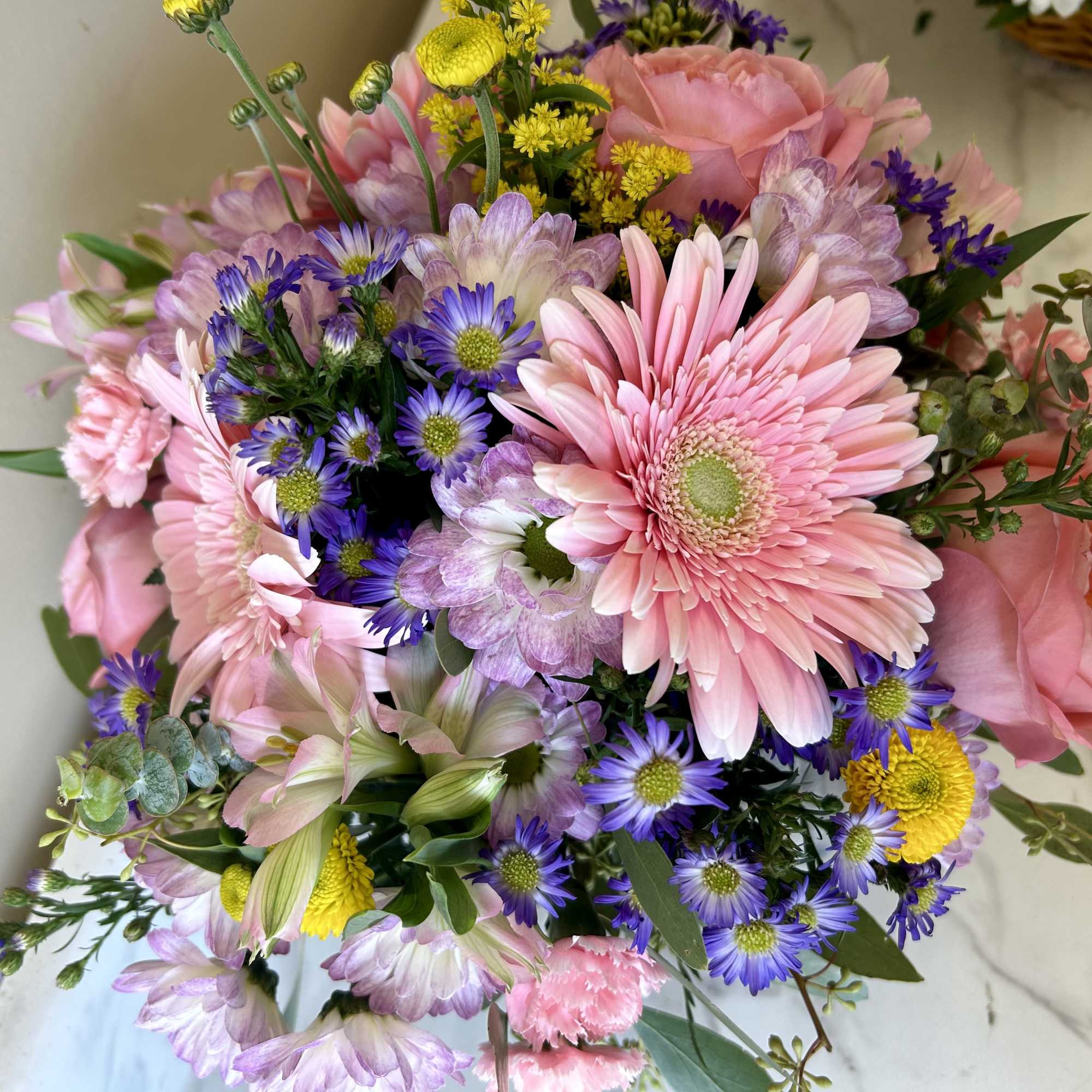 Pink and purple mixed bouquet with gerbera daisies and roses