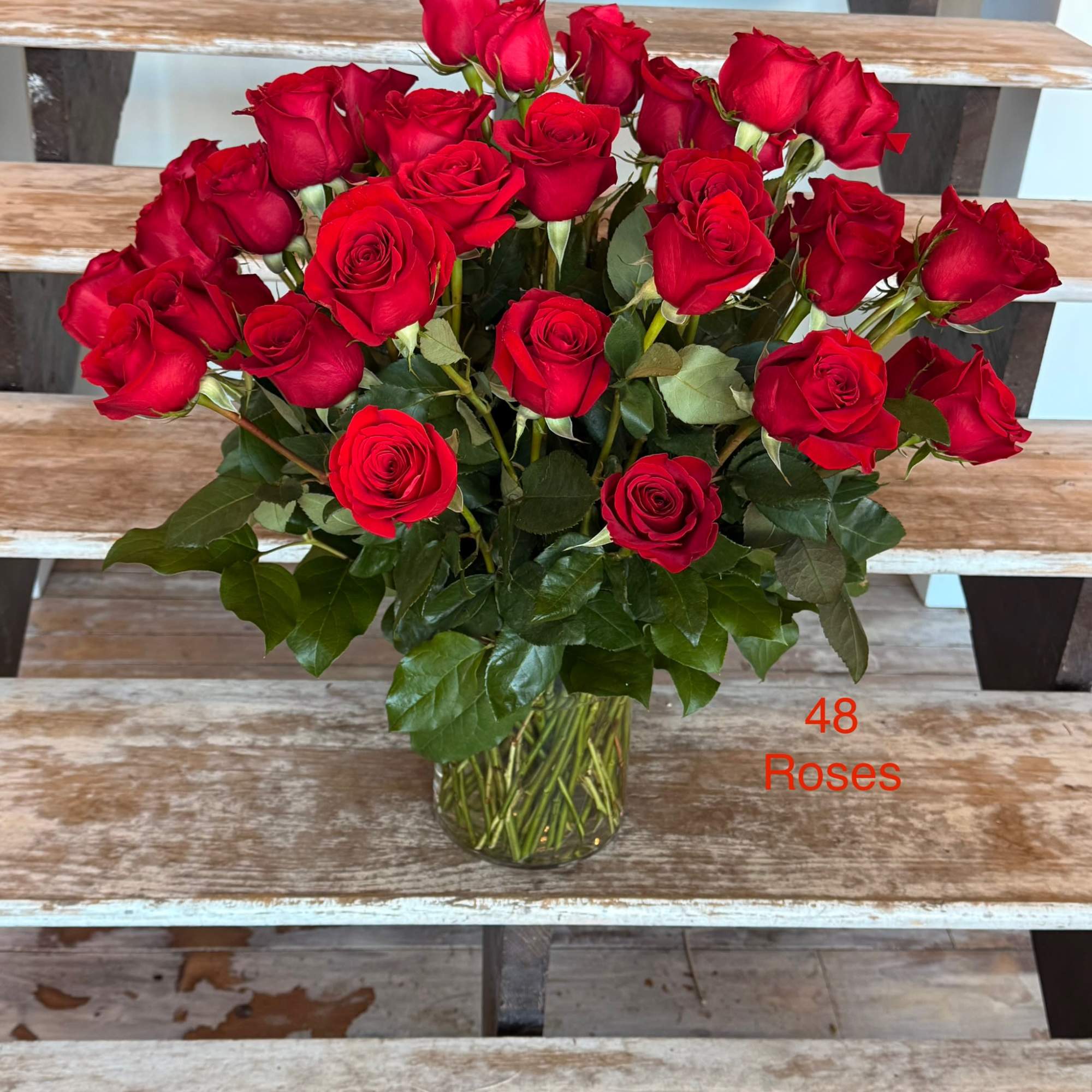 Bouquet of red roses in a clear glass vase
