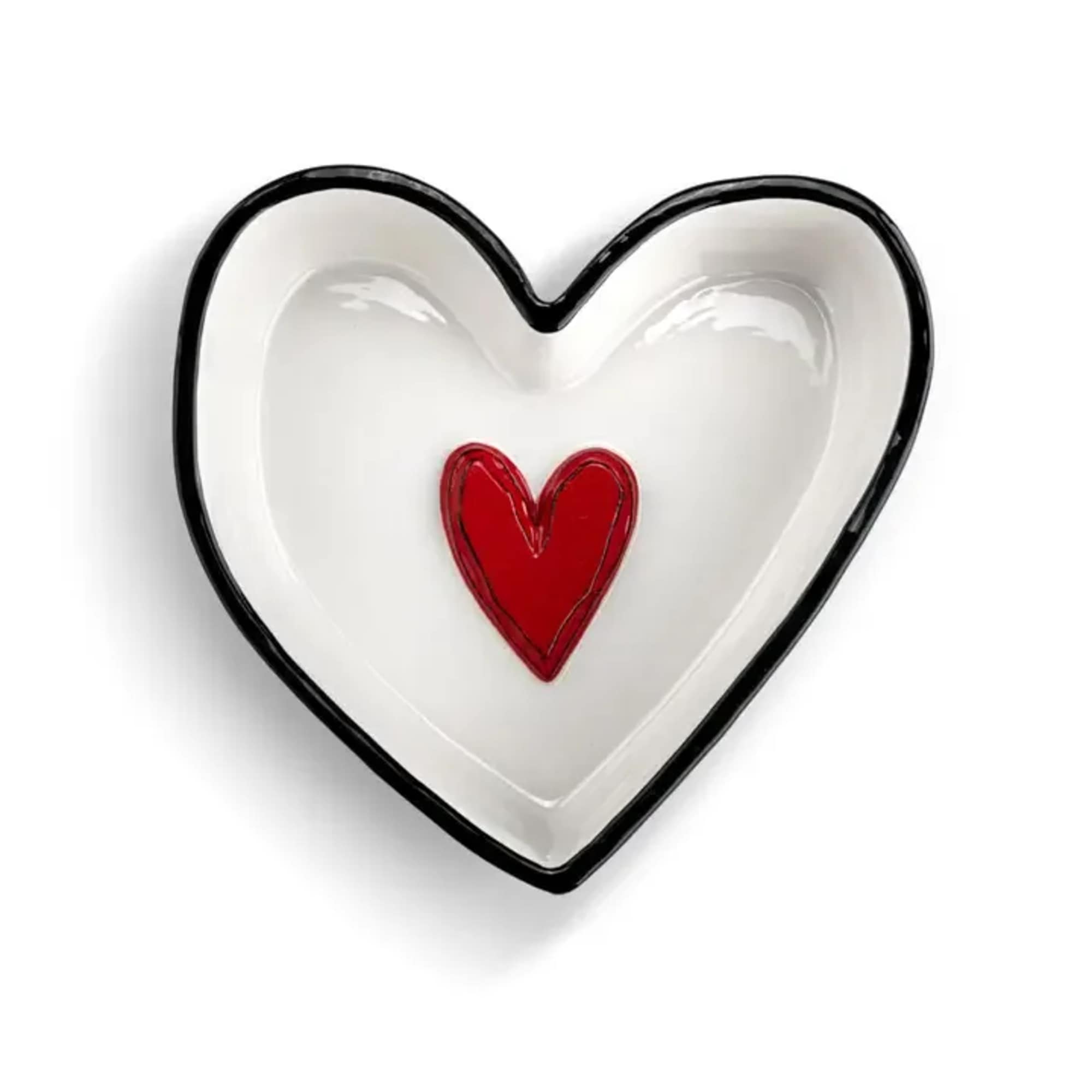 Heart-shaped white dish with a red heart in the center