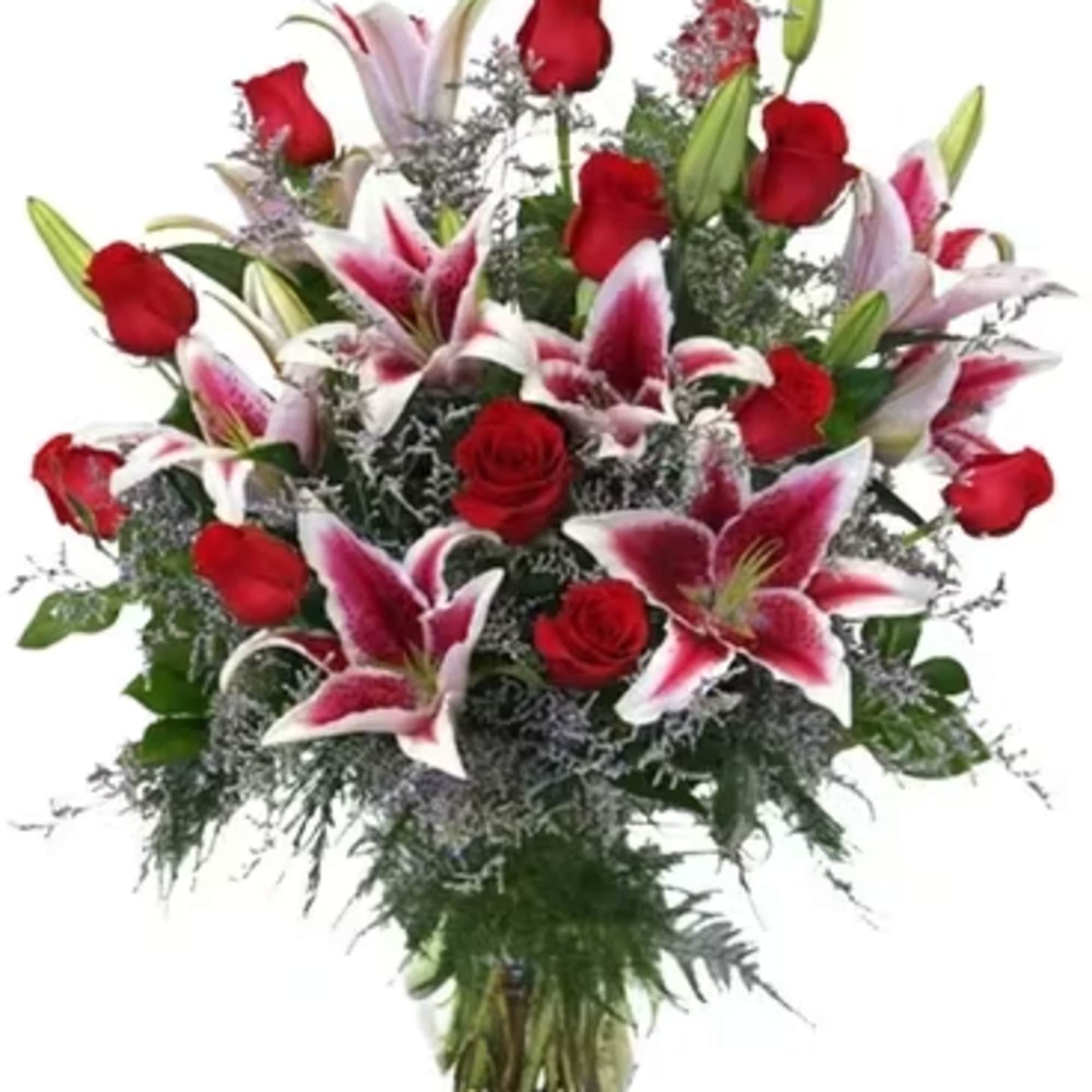 Bouquet of red roses and pink lilies in a glass vase