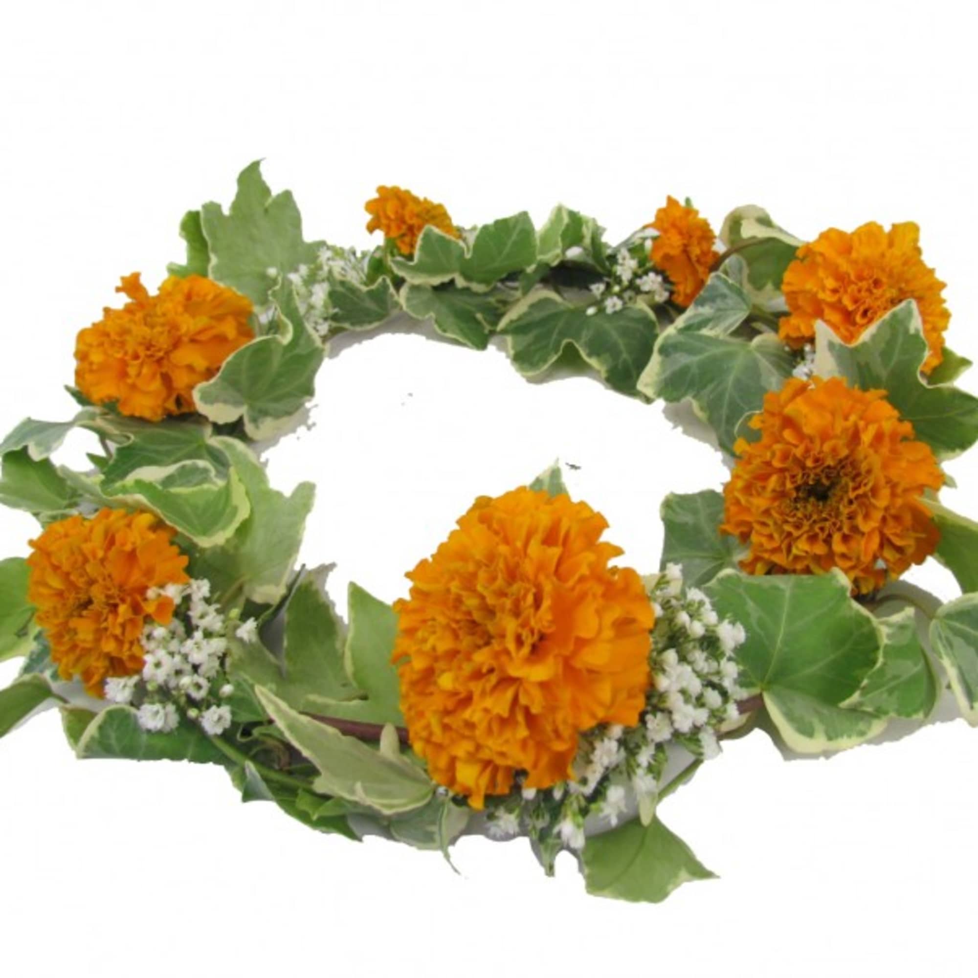 Orange marigold wreath with variegated ivy and small white filler flowers