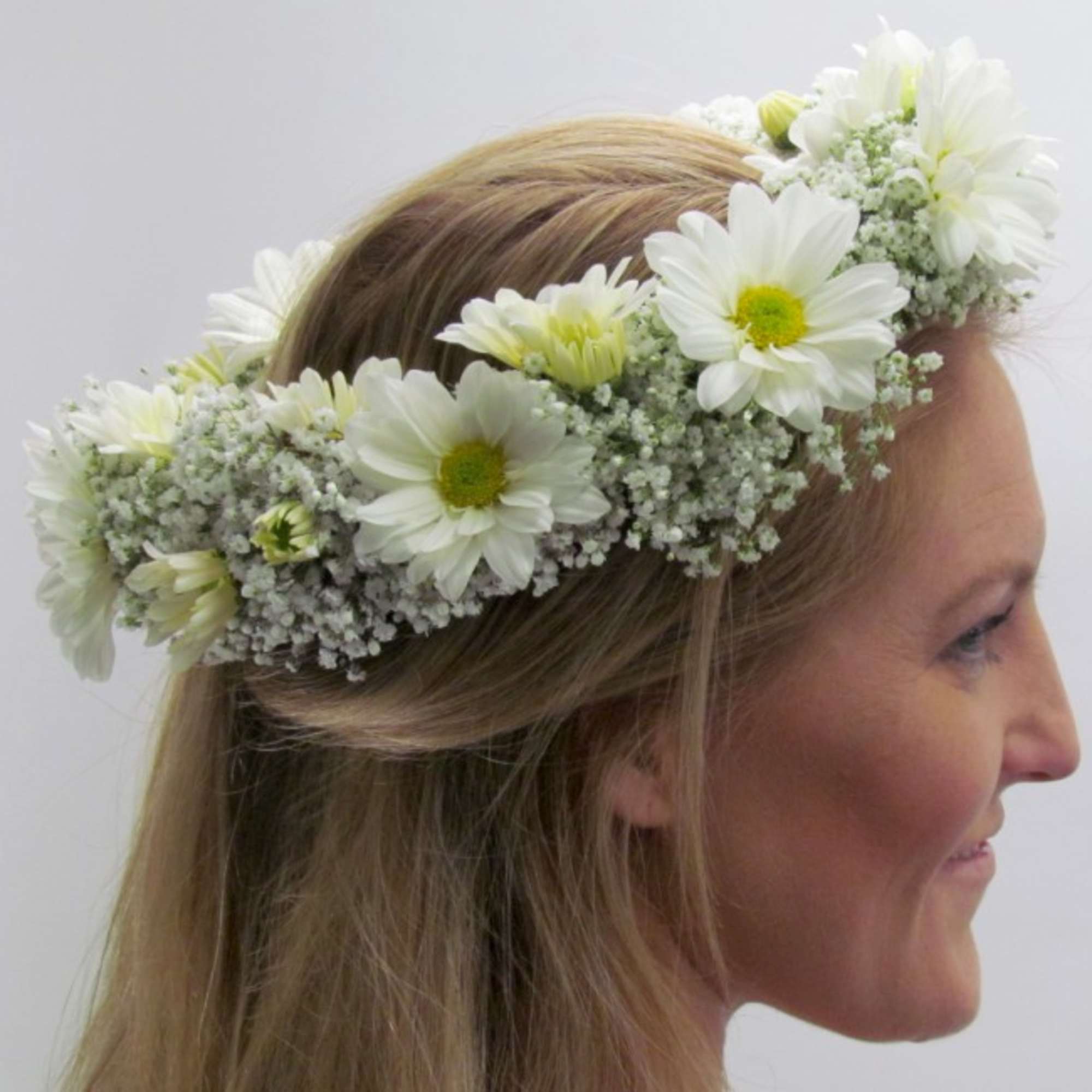 White daisy flower crown on a woman's head