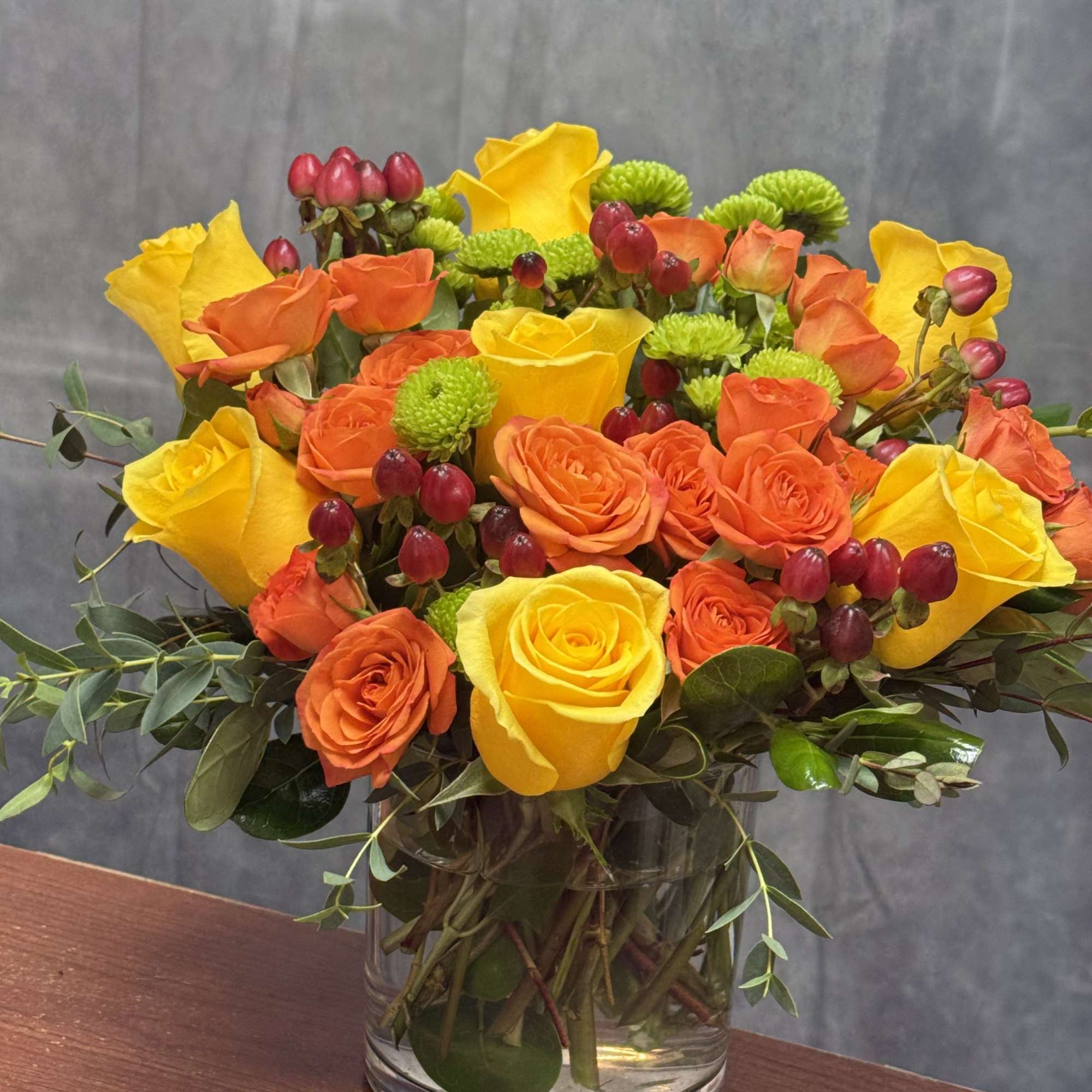 A vibrant and lively arrangement of yellow and orange roses , lime, photo 2 of 2