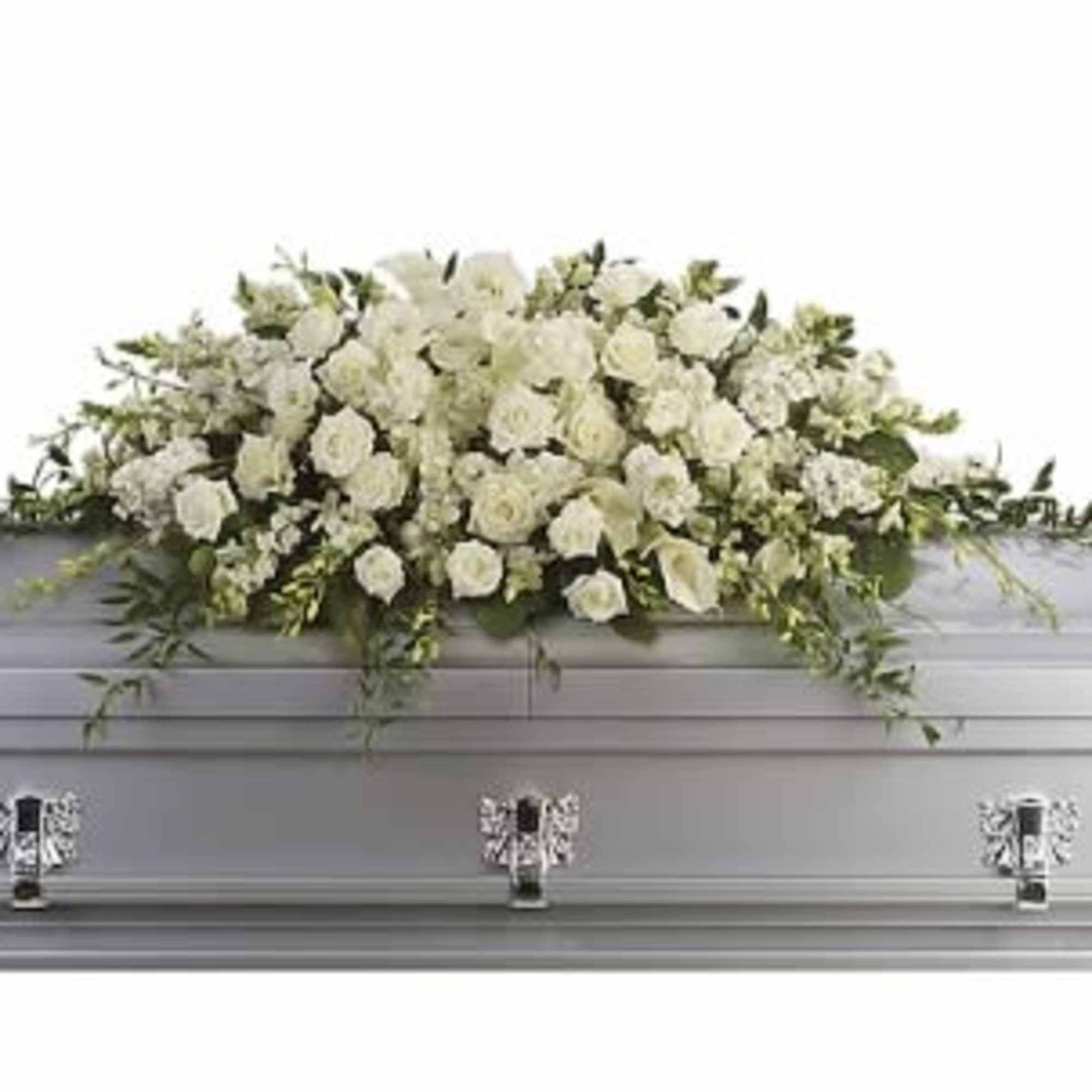 White floral casket spray on a silver casket