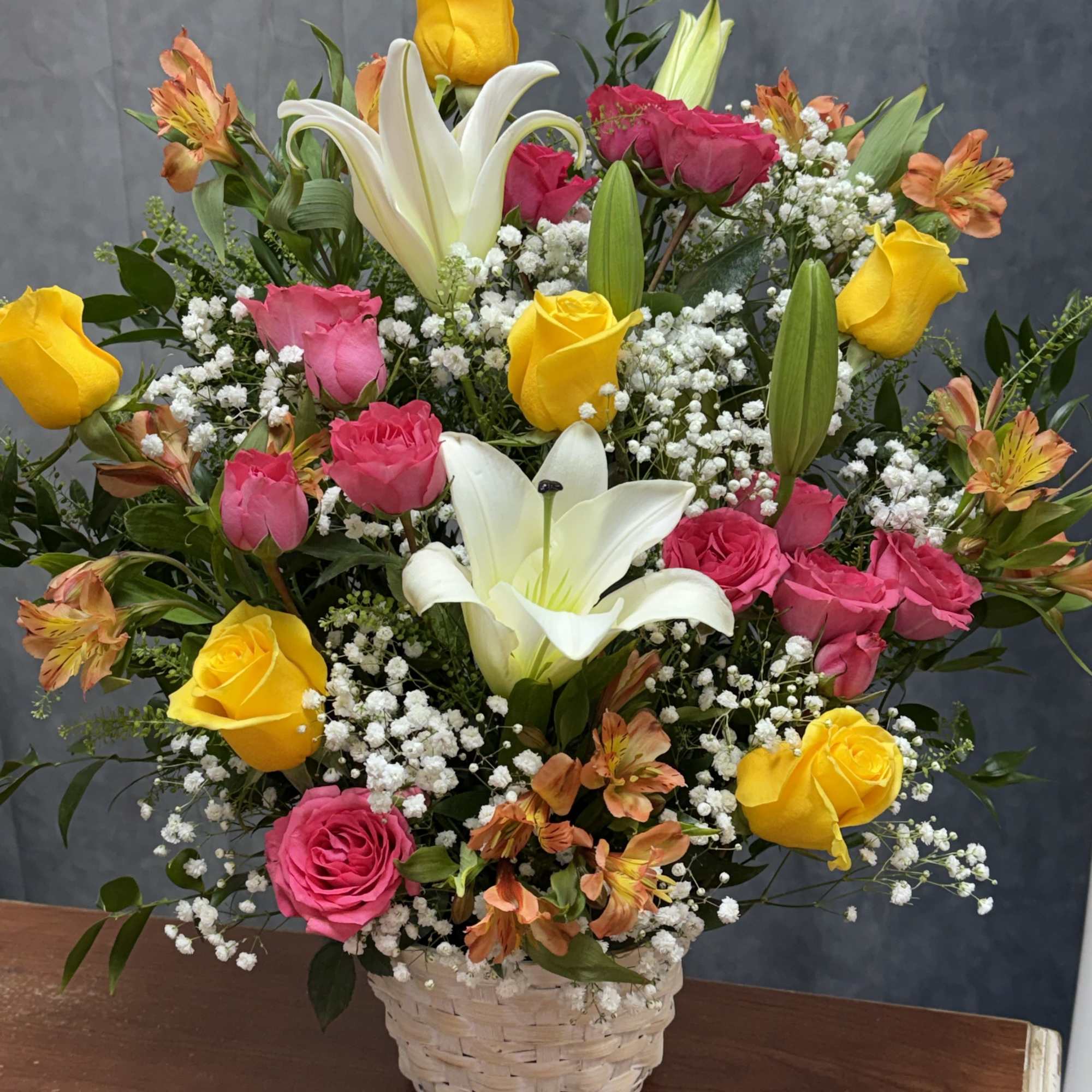 Bright pink, yellow and orange roses and alstroemeria with white lilies and, photo 2 of 2