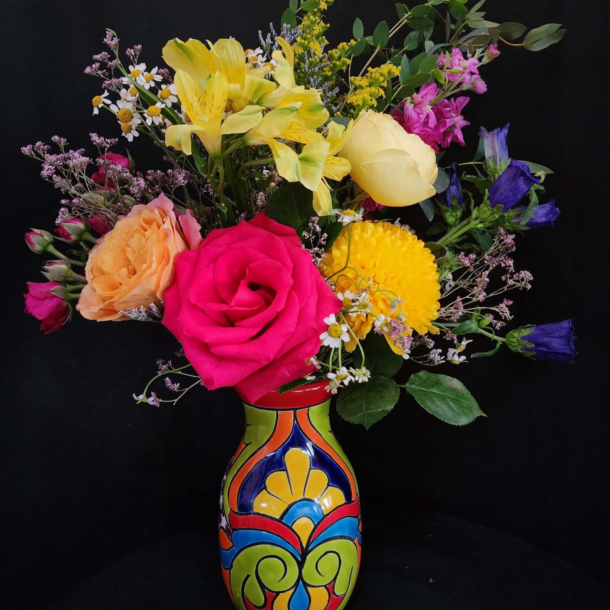 This arrangement represents the beautiful flower colors of Mexican culture and traditions