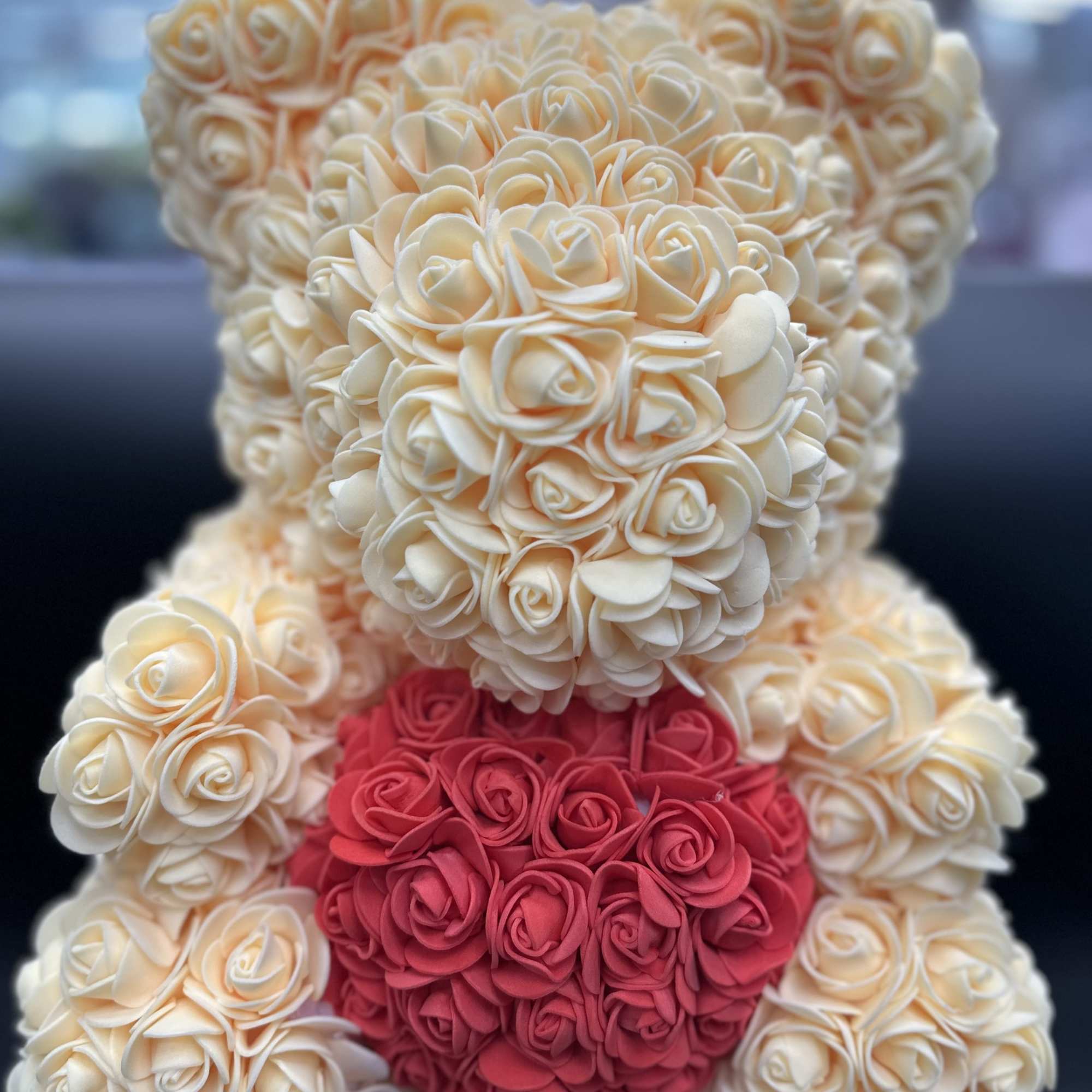 Cream and pink rose teddy bear made of artificial flowers