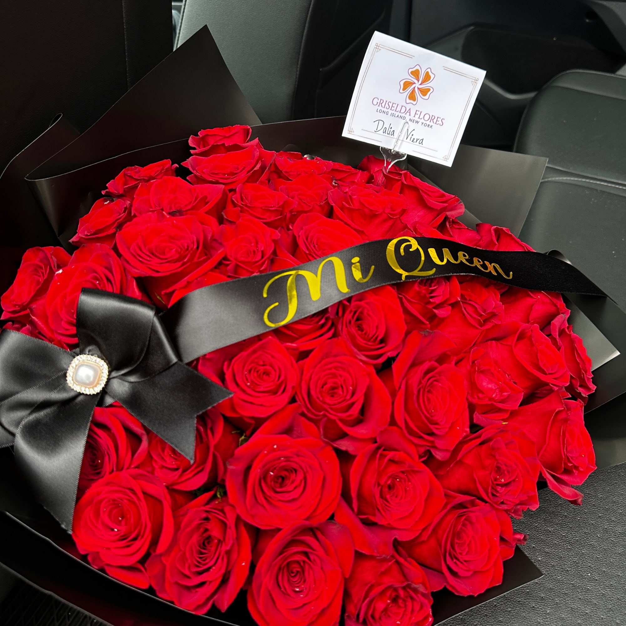 Large bouquet of red roses wrapped in black paper with a black ribbon, photo 5 of 5