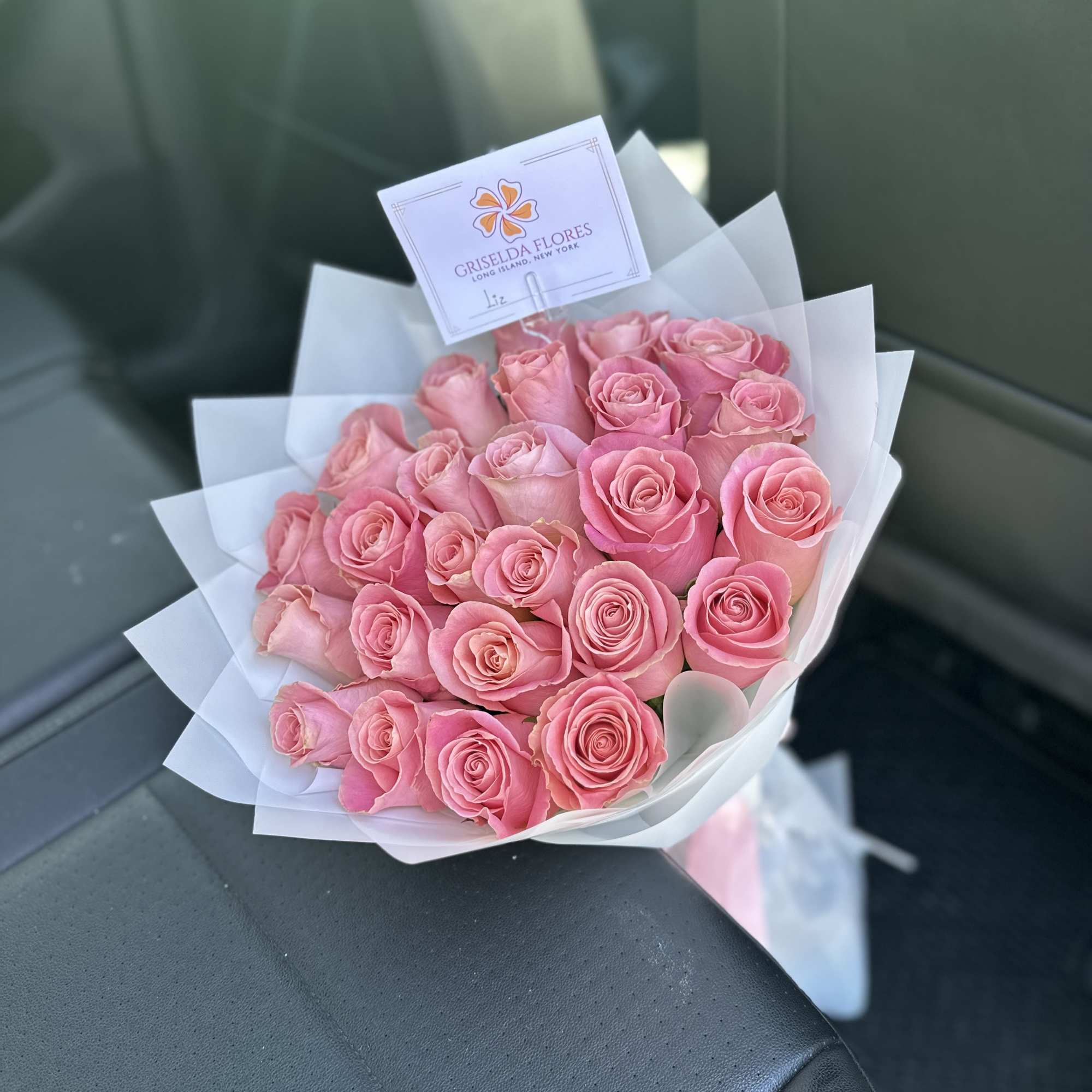Bouquet of pink roses wrapped in white paper, photo 2 of 2