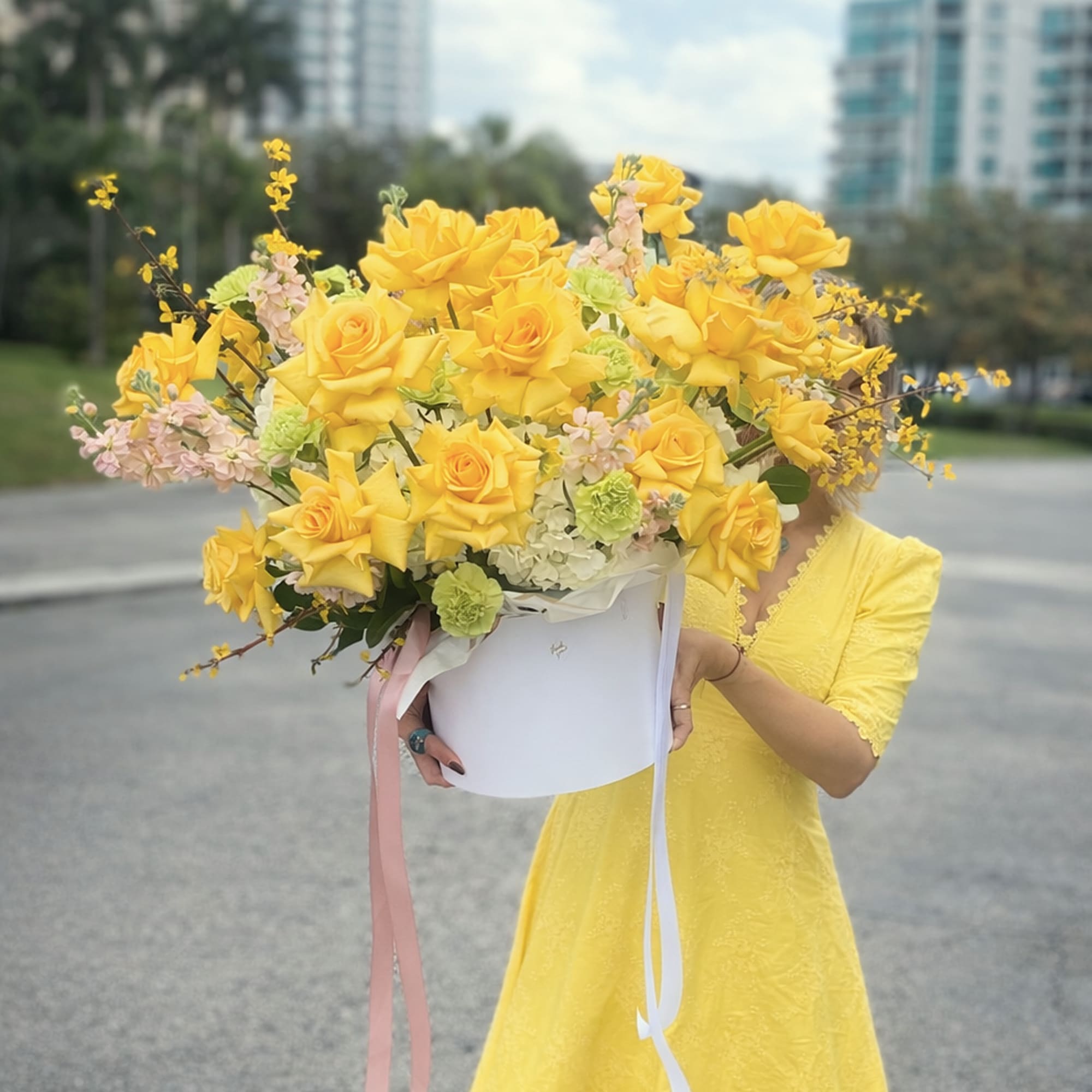 A bright cluster of sunny yellow roses makes an immediate, joyful impression