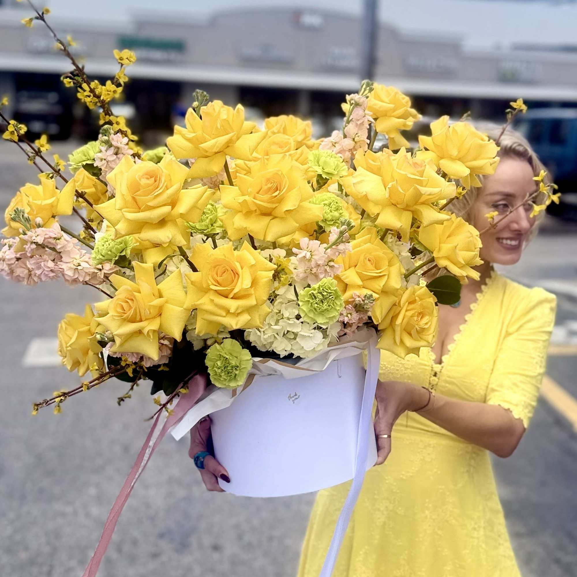 A bright cluster of sunny yellow roses makes an immediate, joyful impression
