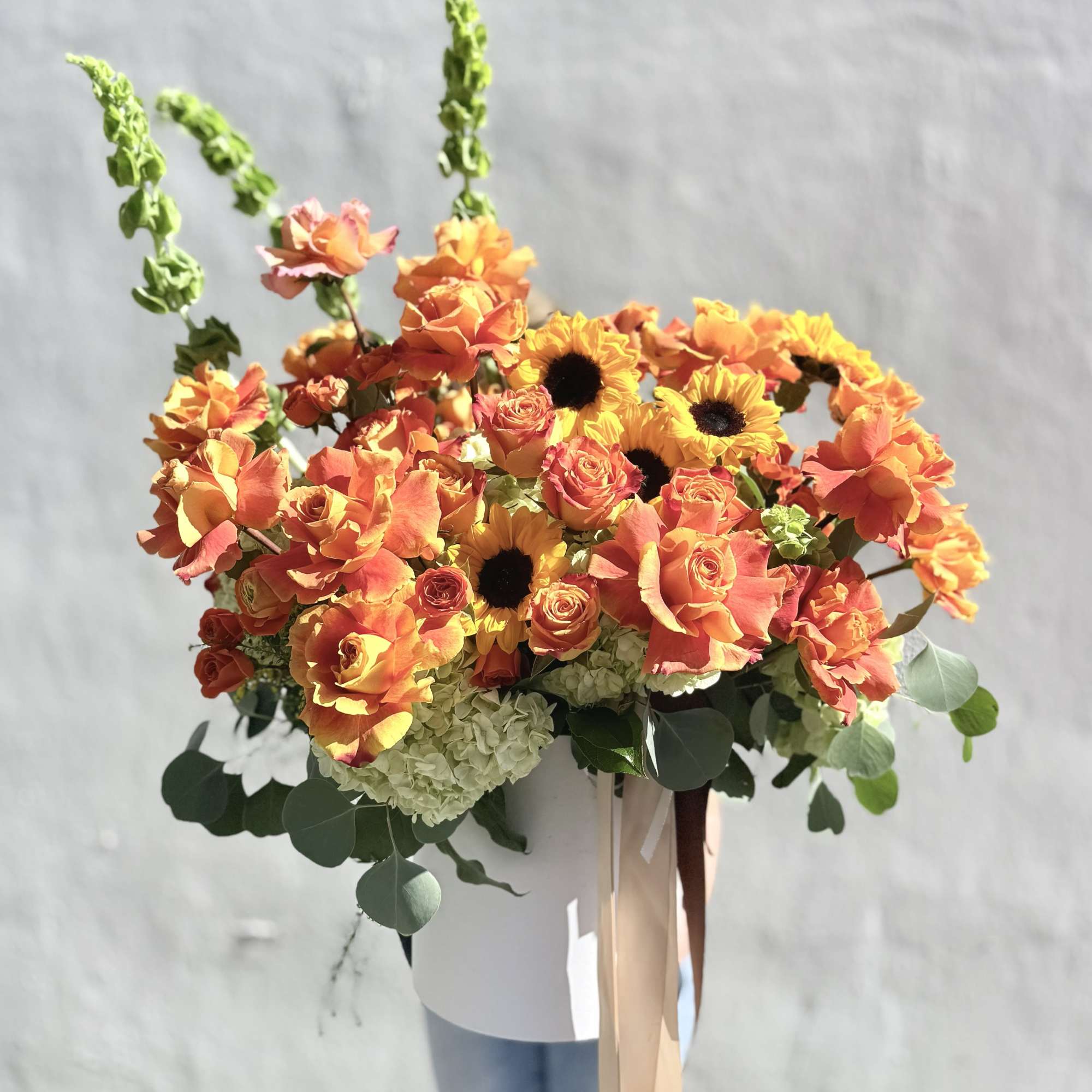 A burst of warm color and sunny texture-this flower arrangement is a