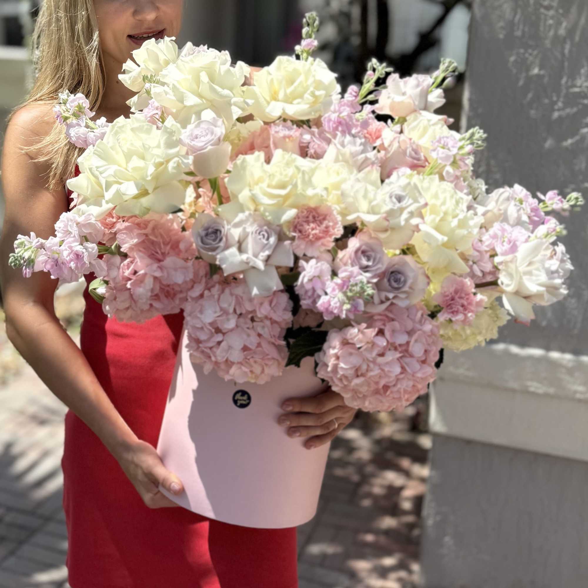 A cloud of cream, blush and lavender blooms arrives tucked into a