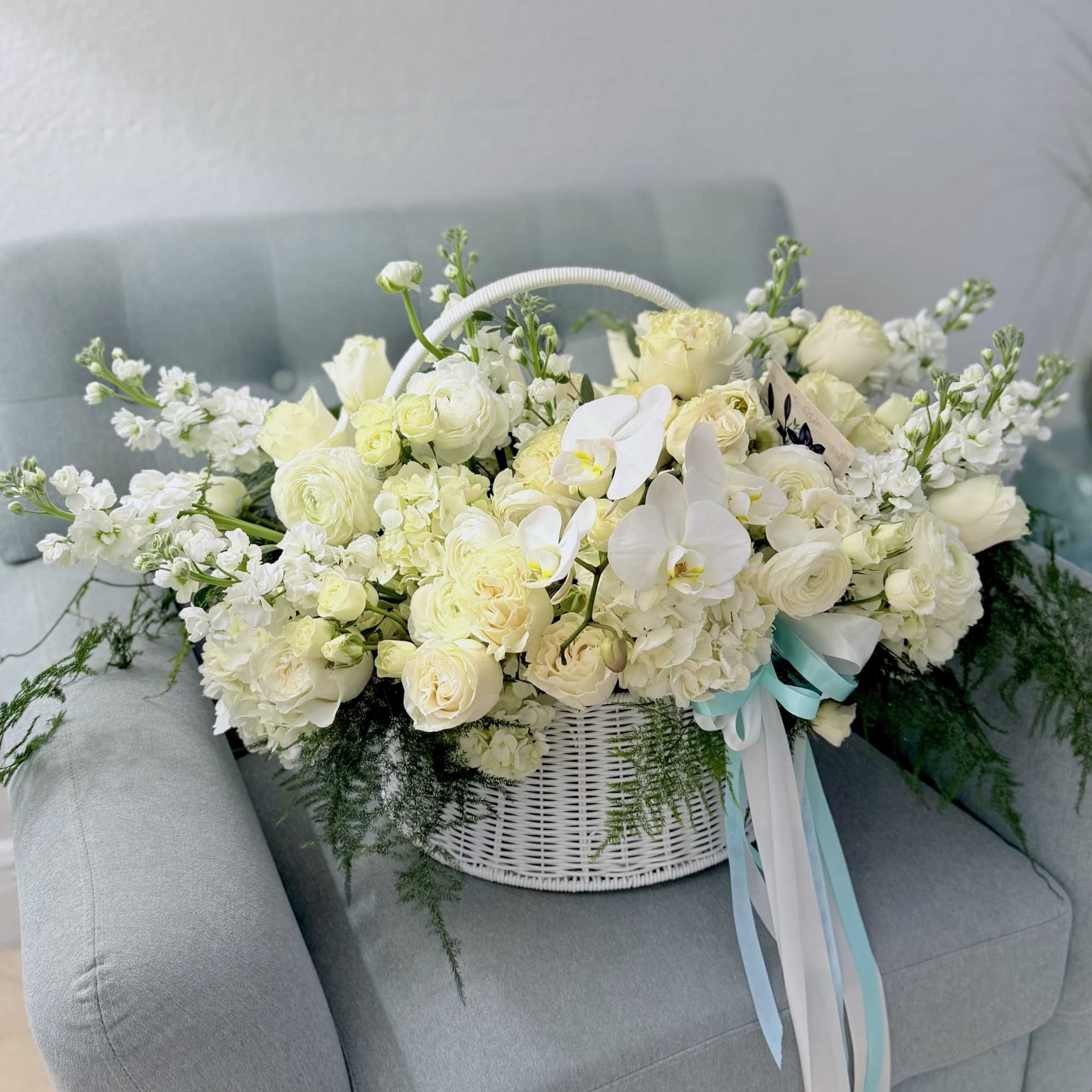 A serene, garden-fresh statement, this large low basket arrangement-ideal as a sympathy