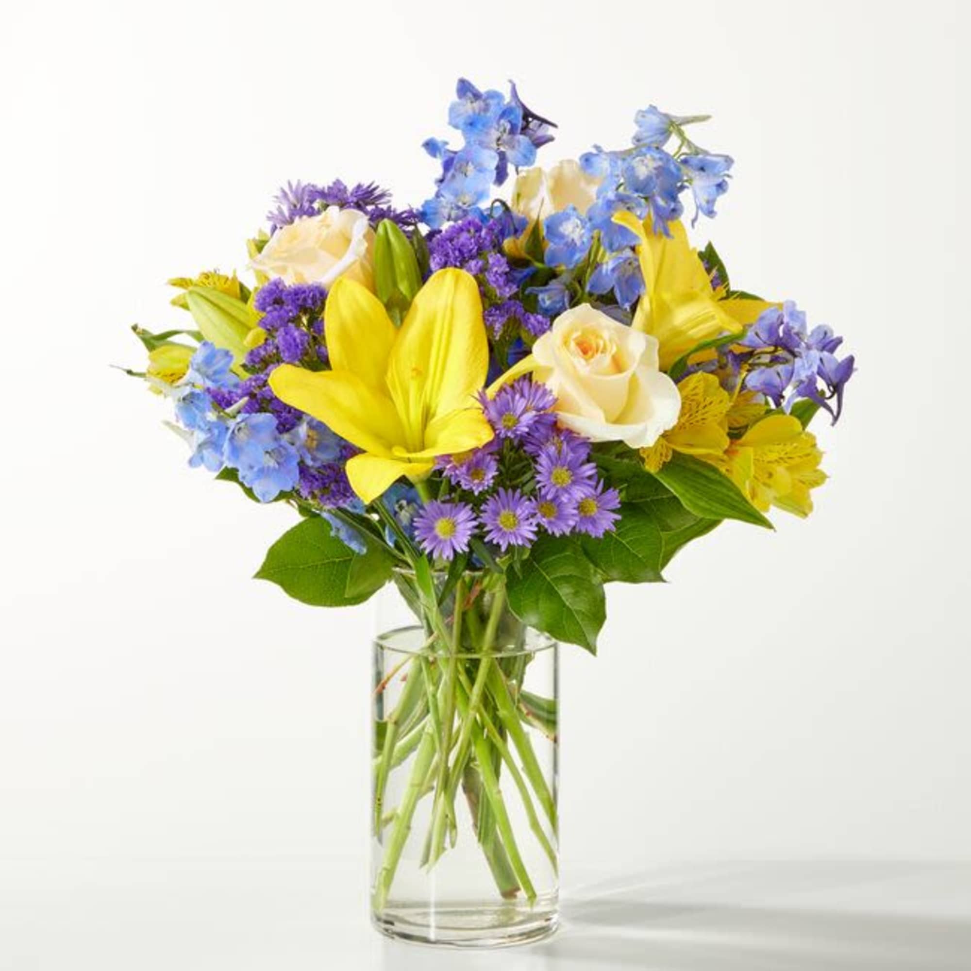 Refreshing and vibrant, this zesty floral arrangement is expertly arranged to create